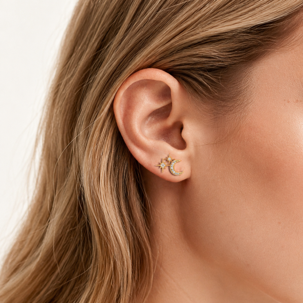 Sterling Silver Star and Moon Zirconia Stud Earrings worn on the ear