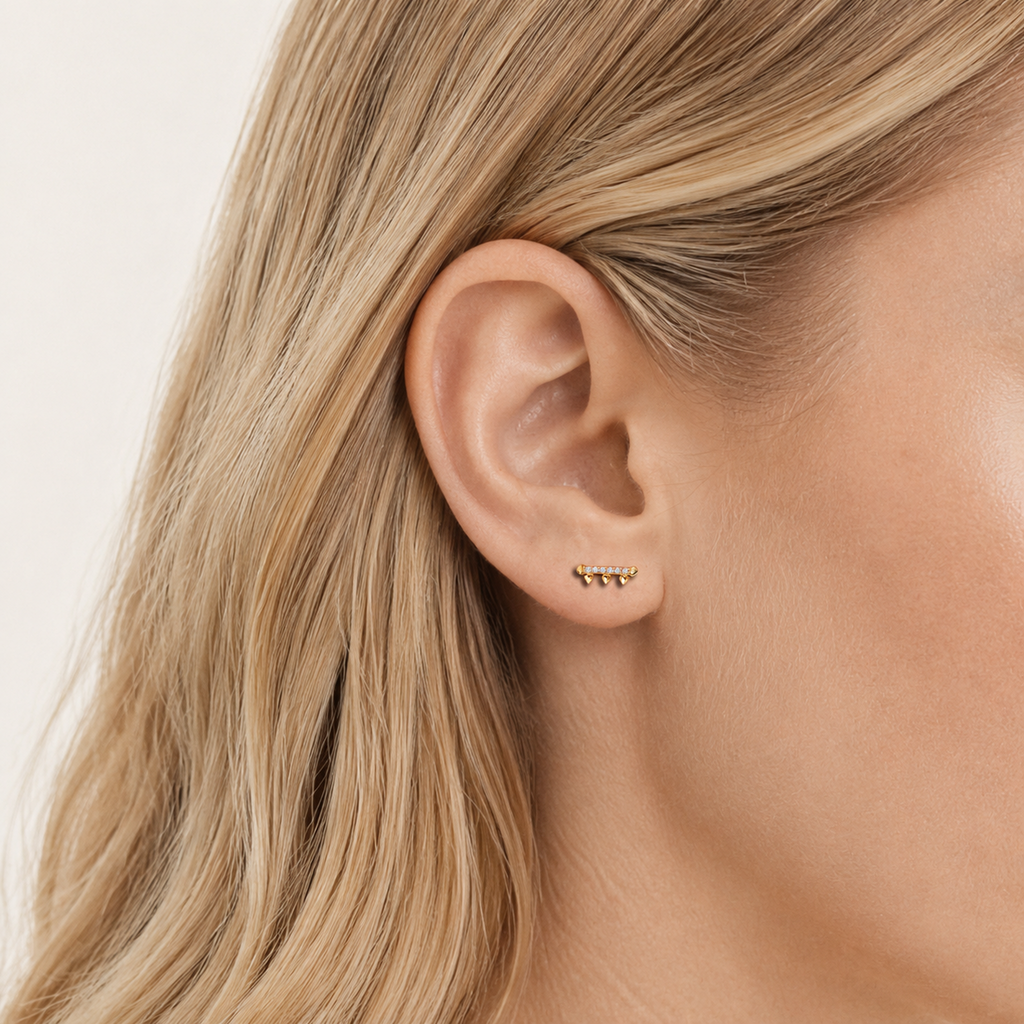 Sterling Silver Zirconia Rake Stud Earrings worn on the ear
