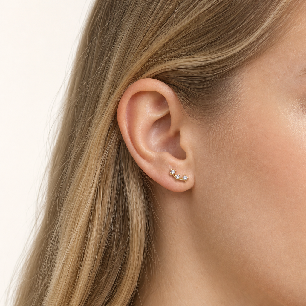 Sterling Silver Triple Star Zirconia Flat Back Earrings worn on the ear