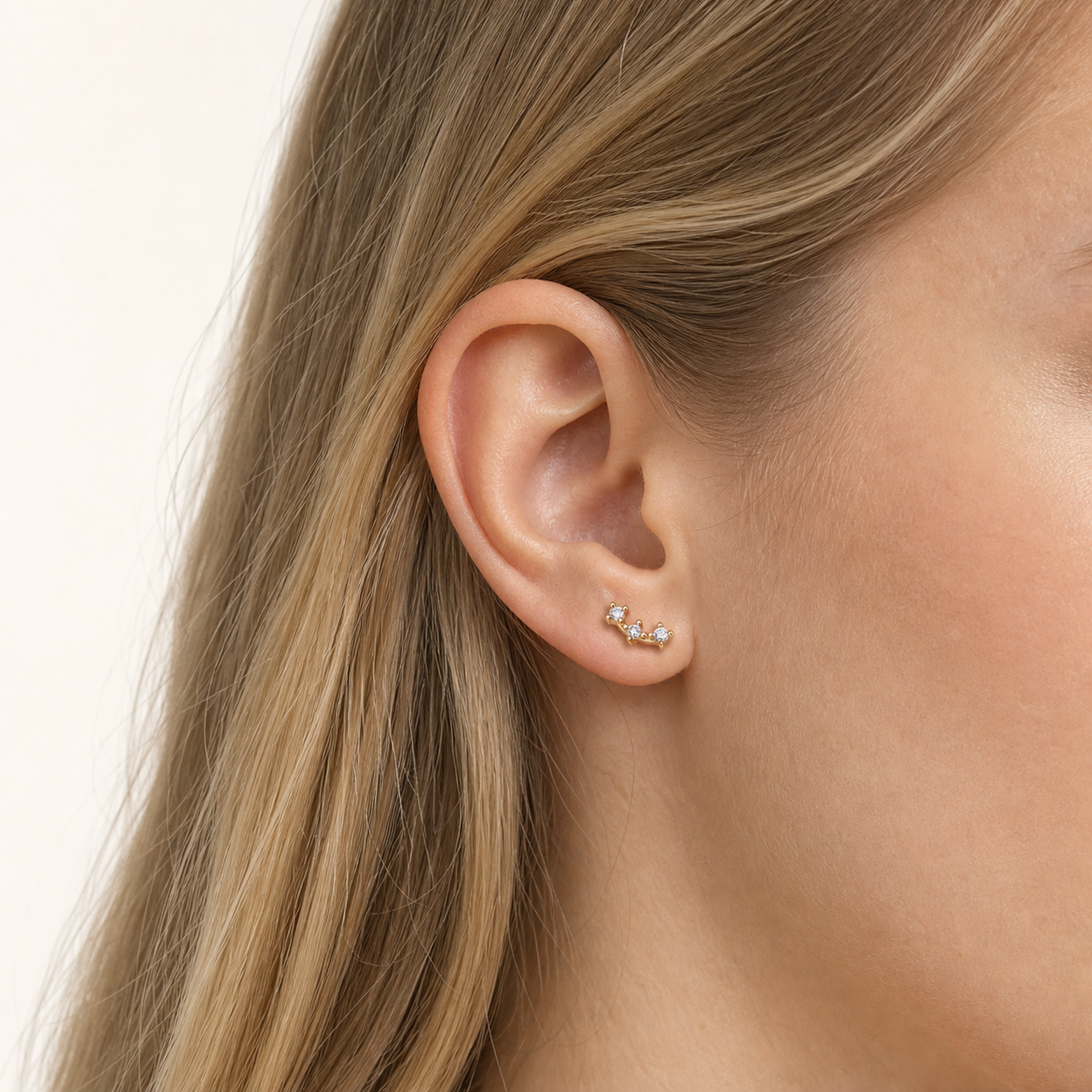 Sterling Silver Triple Star Zirconia Flat Back Earrings worn on the ear