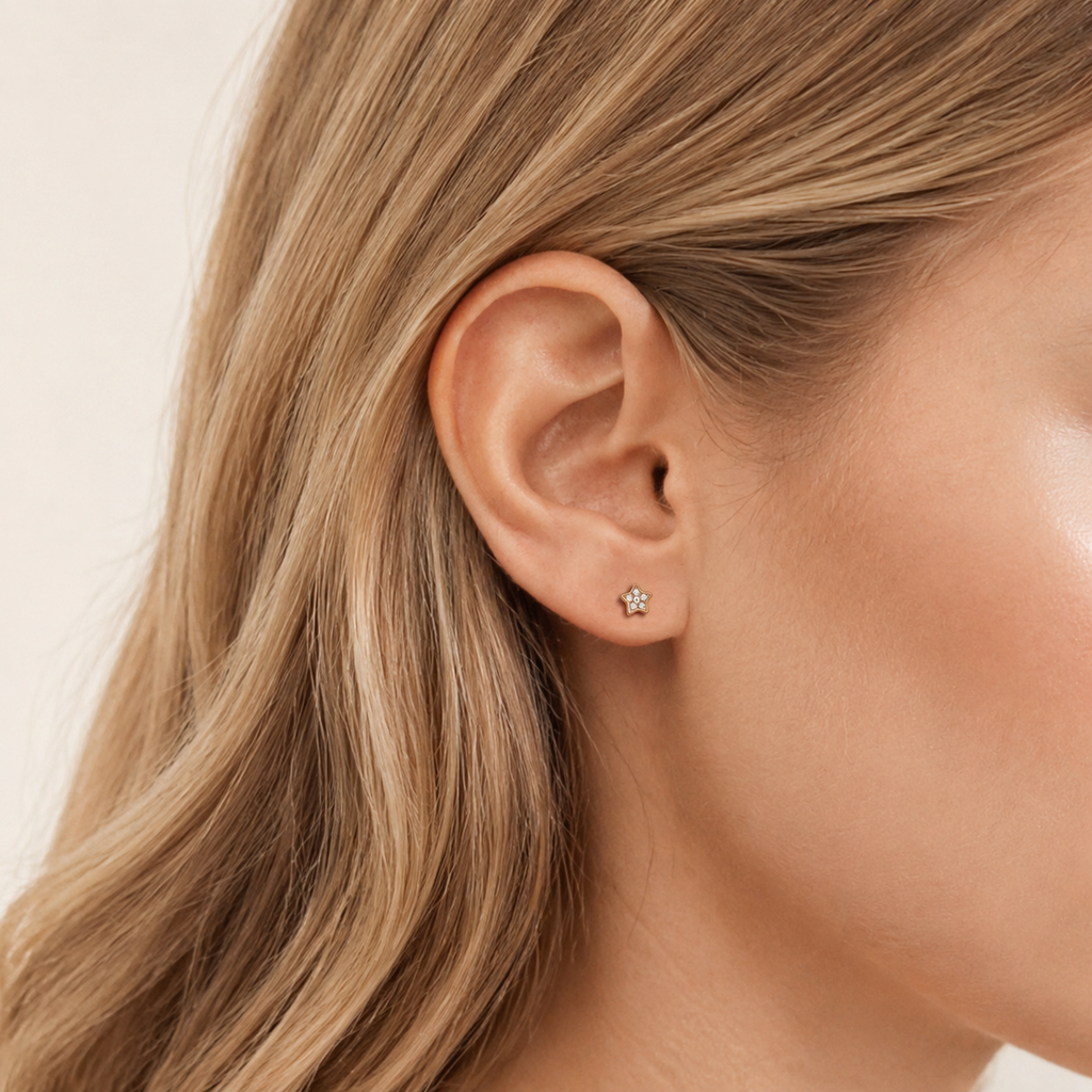 Sterling Silver Zirconia Star Flat Back Earrings worn on the ear