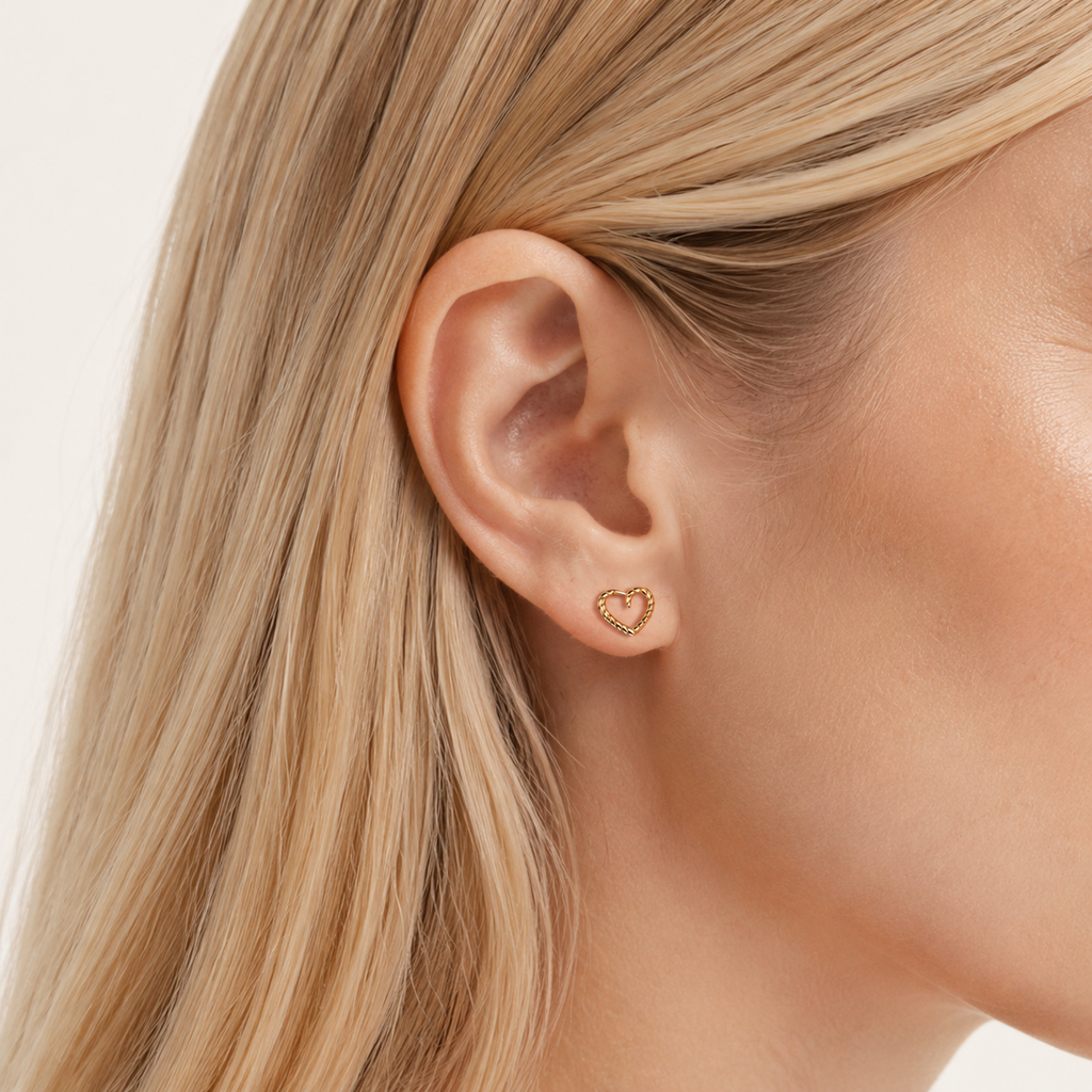 Sterling Silver Polished Heart Stud Earrings worn on the ear