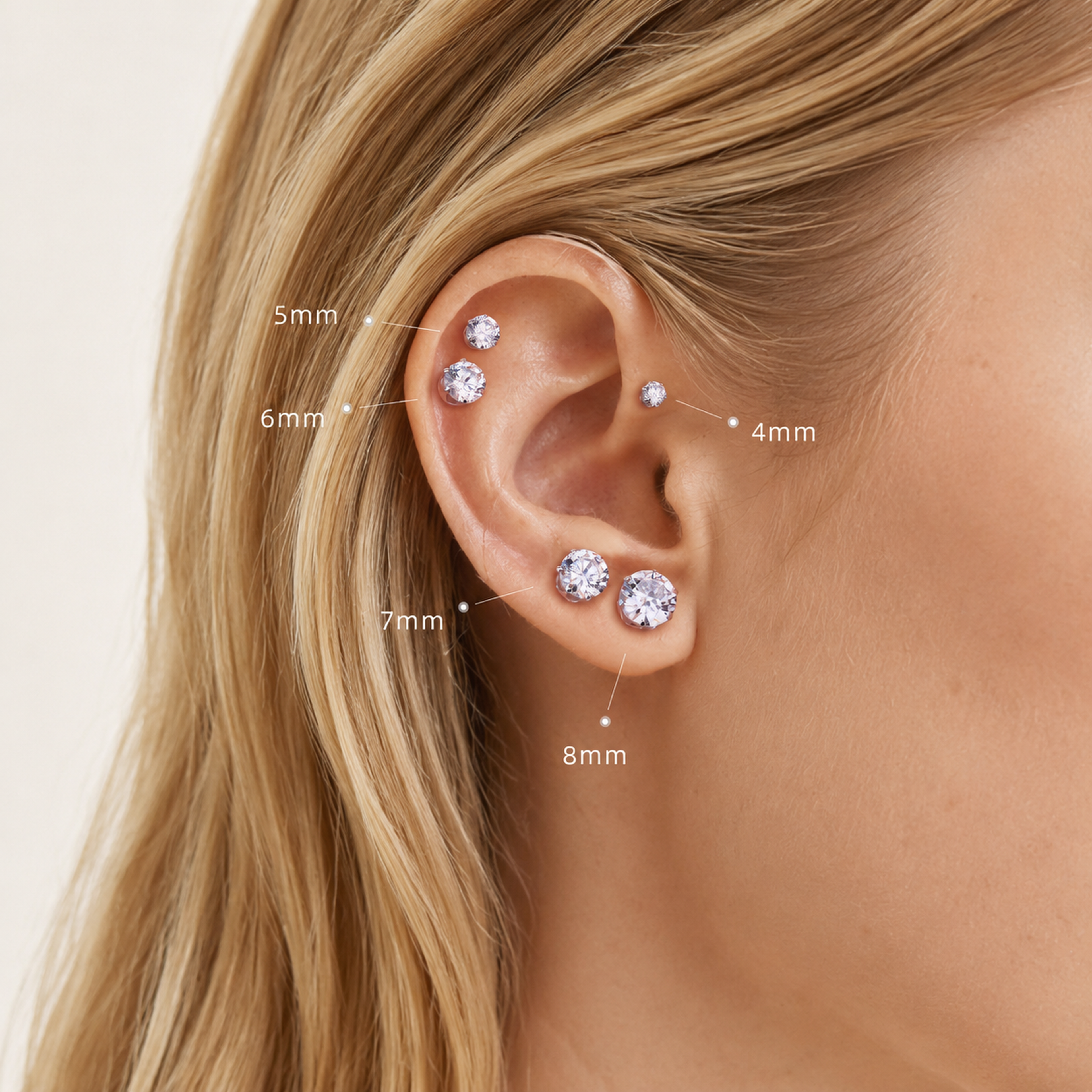 Sterling Silver Six-Prong Moissanite Solitaire Stud Earrings worn on the ear
