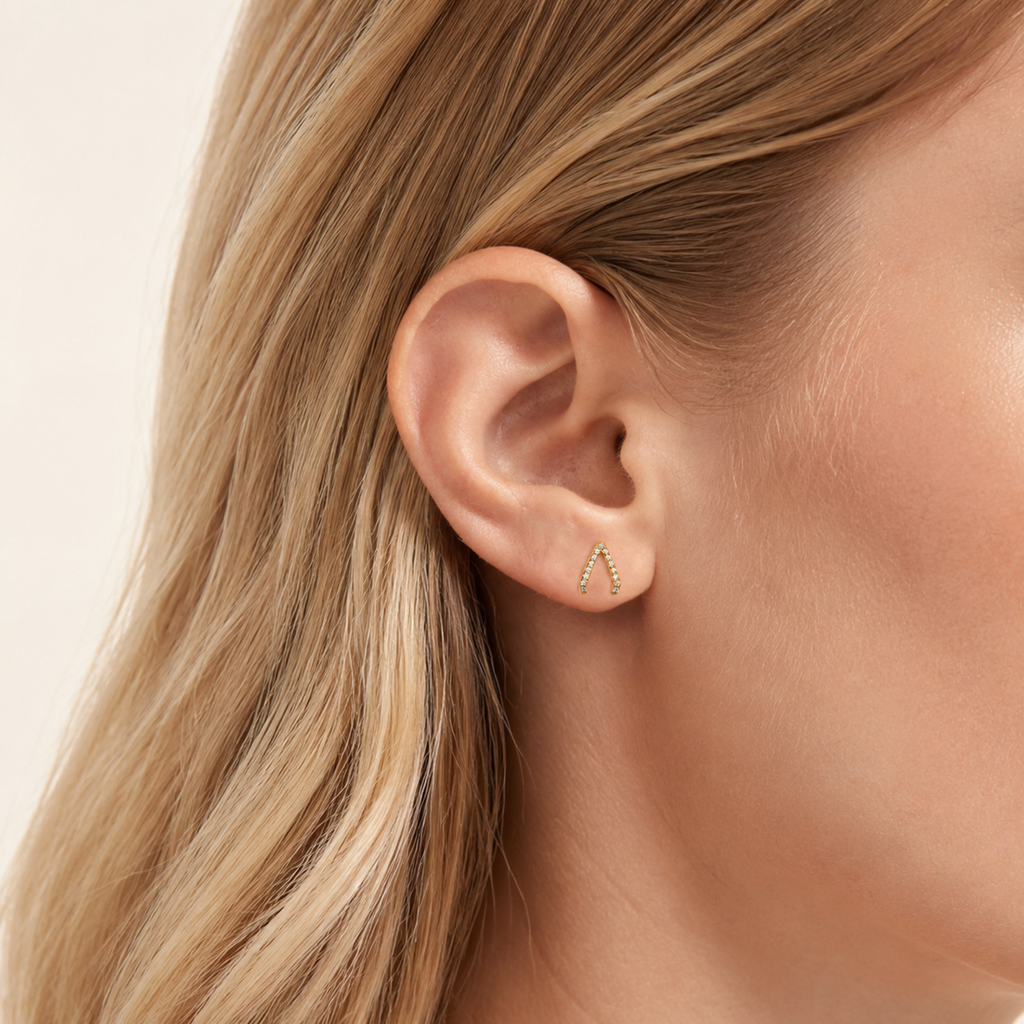 Sterling Silver Inverted Triangle Zirconia Stud Earrings worn on the ear