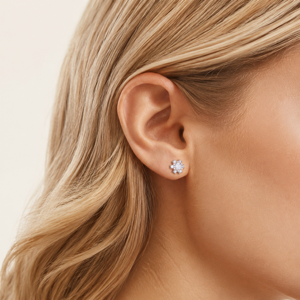 Sterling Silver Moissanite Snowflake Stud Earrings worn on the ear