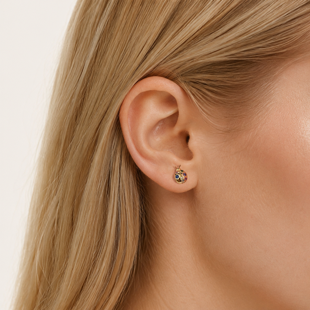 Sterling Silver Color Zirconia Ladybug Stud Earrings worn on the ear