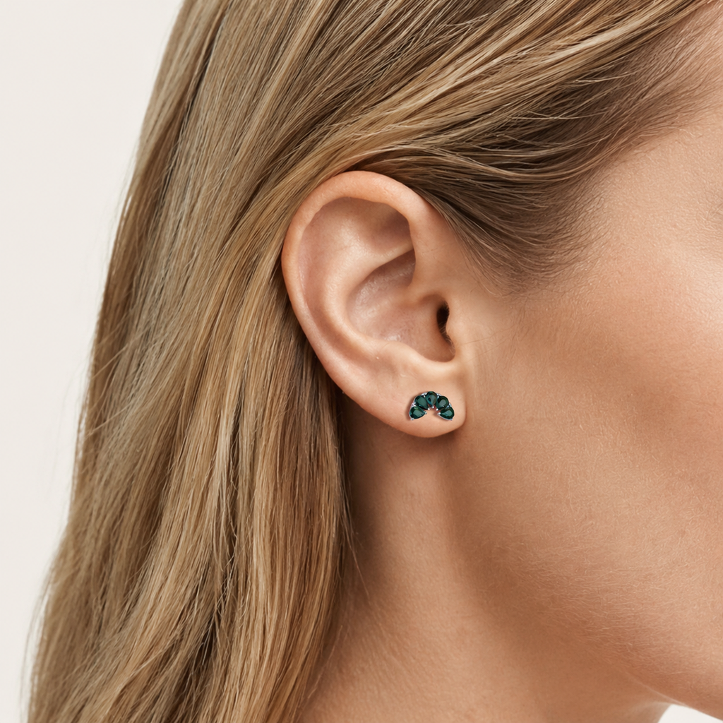 Sterling Silver Green Teardrop Zirconia Flat Back Earrings worn on the ear