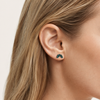 Sterling Silver Green Teardrop Zirconia Flat Back Earrings worn on the ear