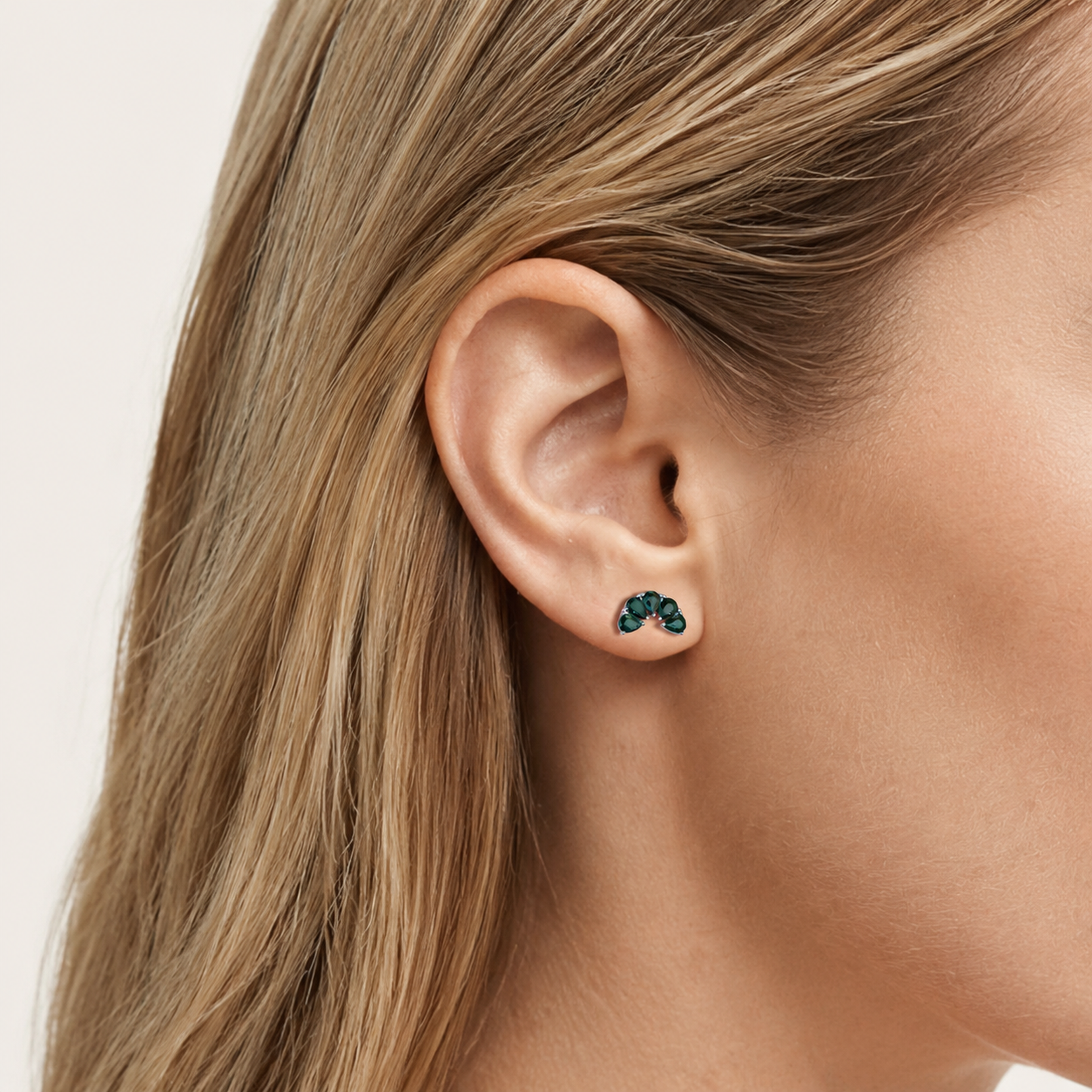 Sterling Silver Green Teardrop Zirconia Flat Back Earrings worn on the ear
