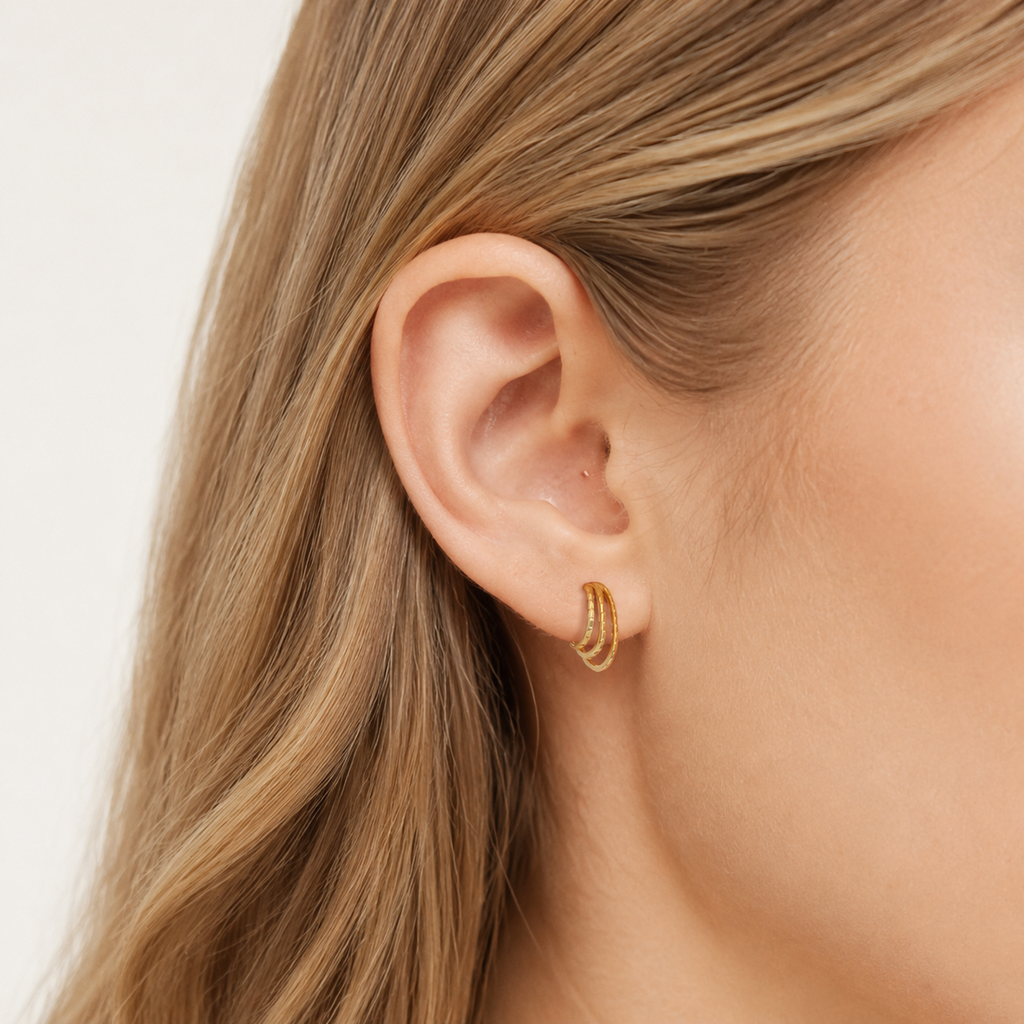 Sterling Silver Layered Arc Stud Earrings worn on the ear