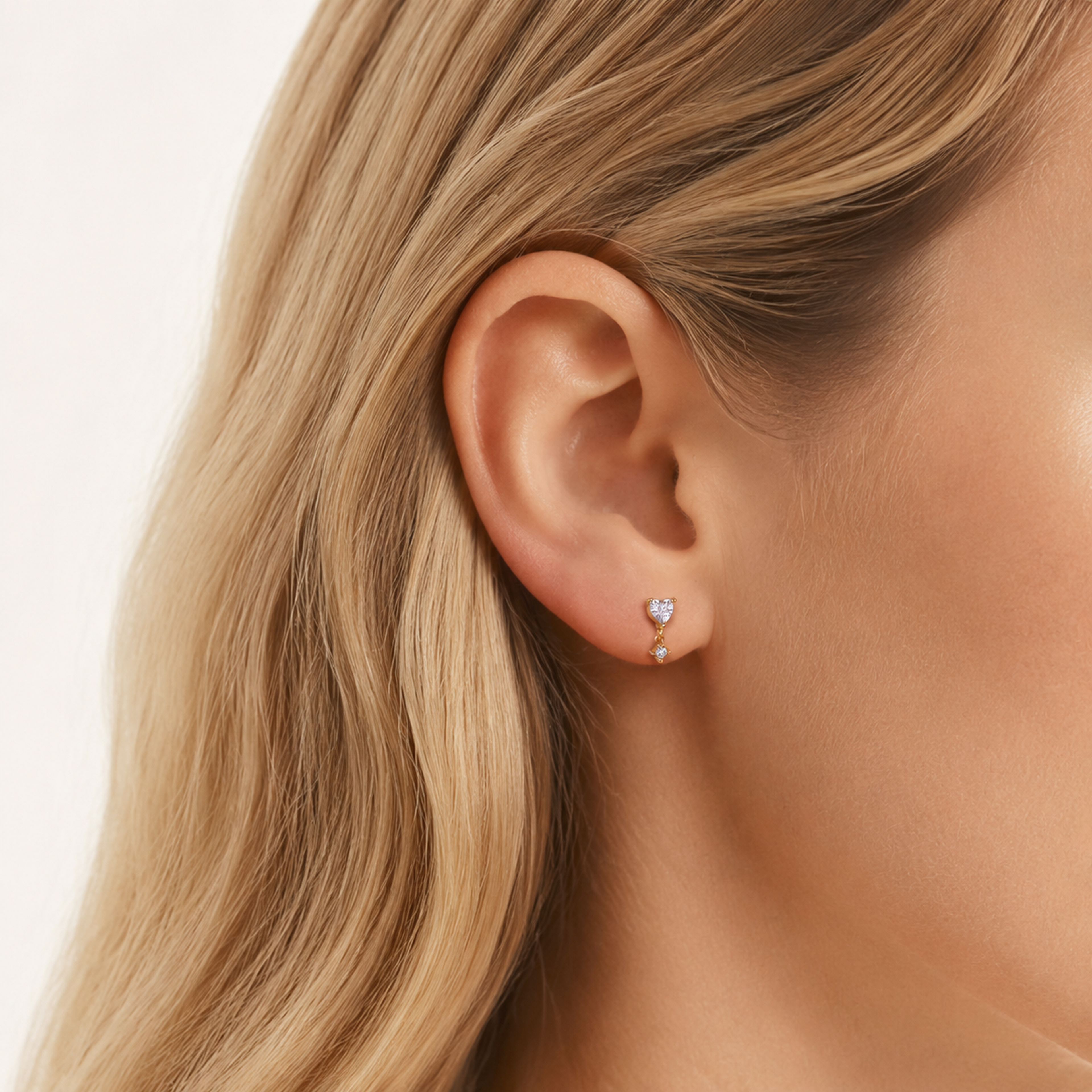 Sterling Silver Zirconia Heart Drop Flat Back Earrings worn on the ear