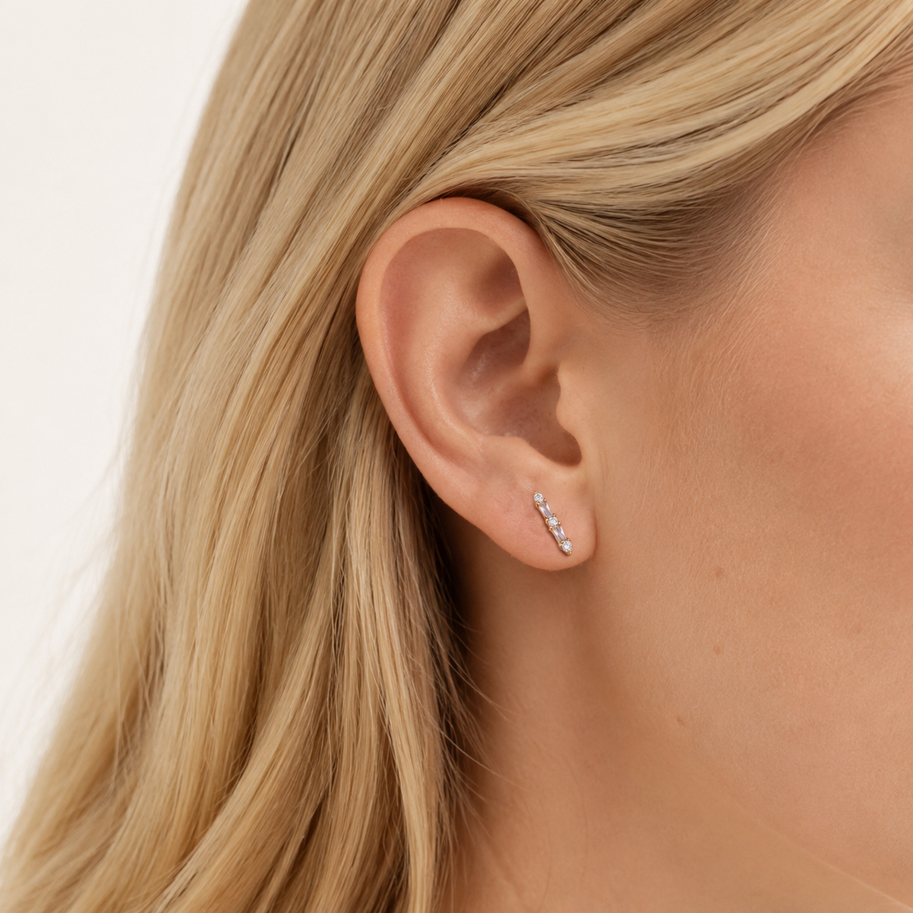 Sterling Silver Zirconia Bar Stud Earrings worn on the ear
