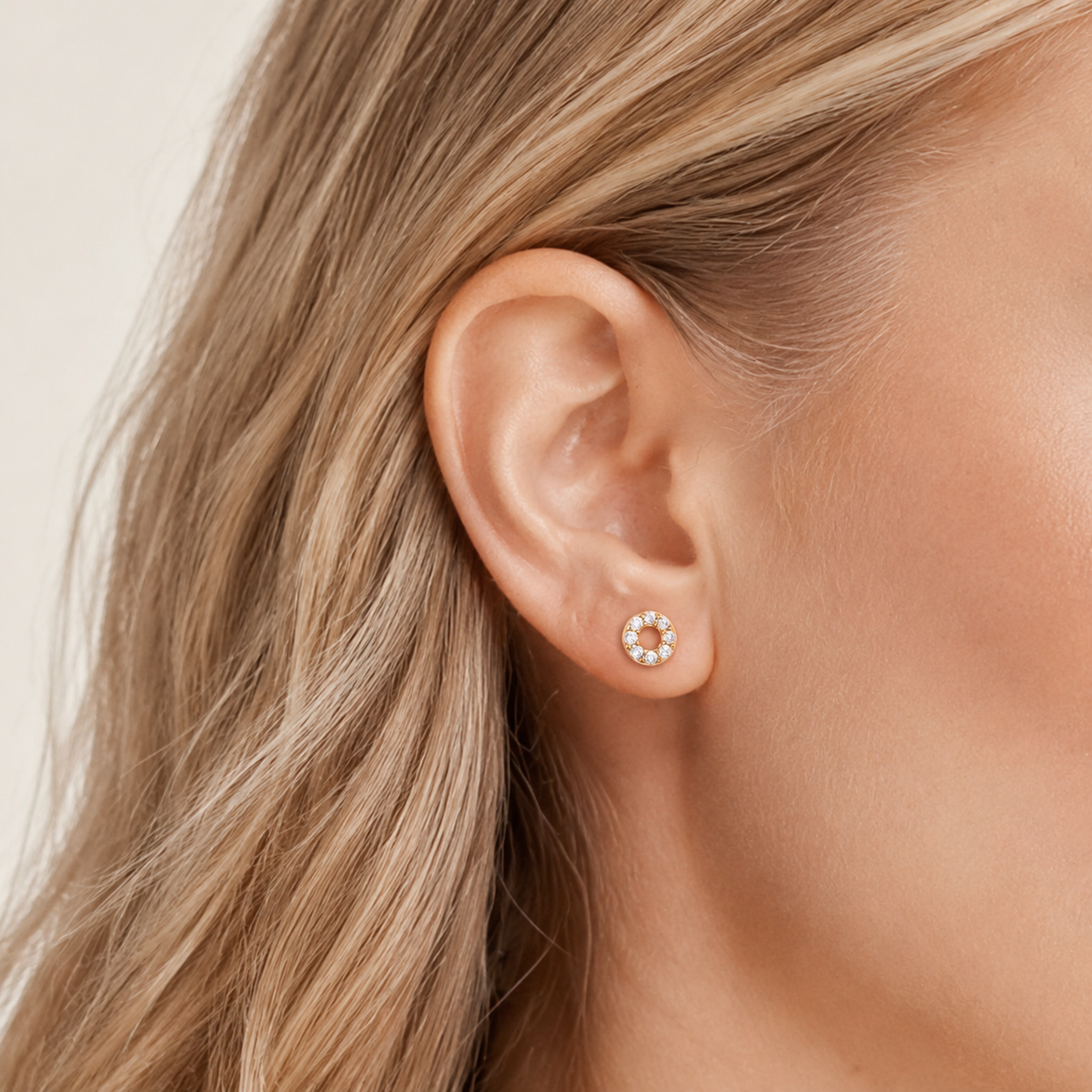 Sterling Silver Twisted Zirconia Circle Flat Back Earrings worn on the ear