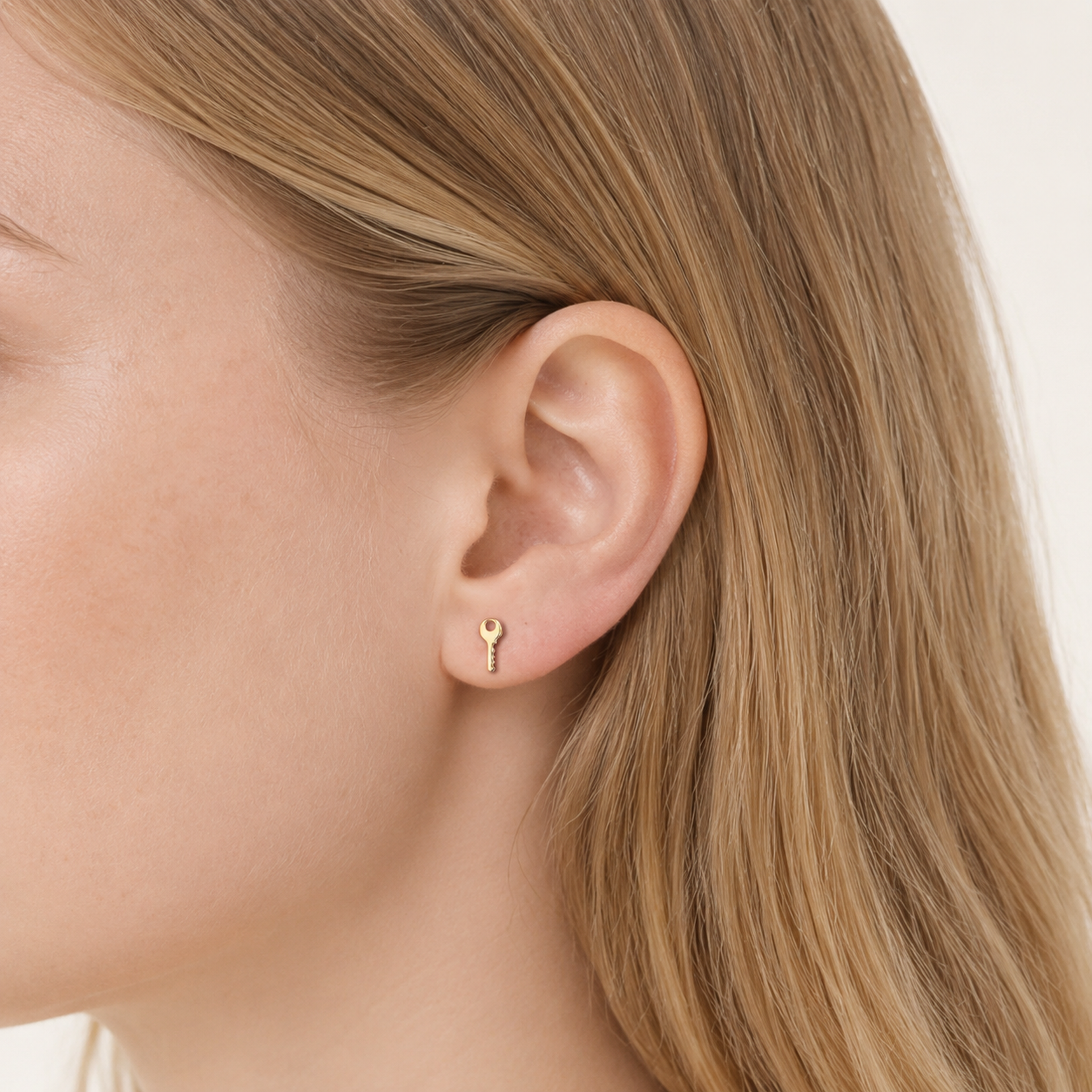 Sterling Silver Lock & Key Stud Earrings worn on the ear