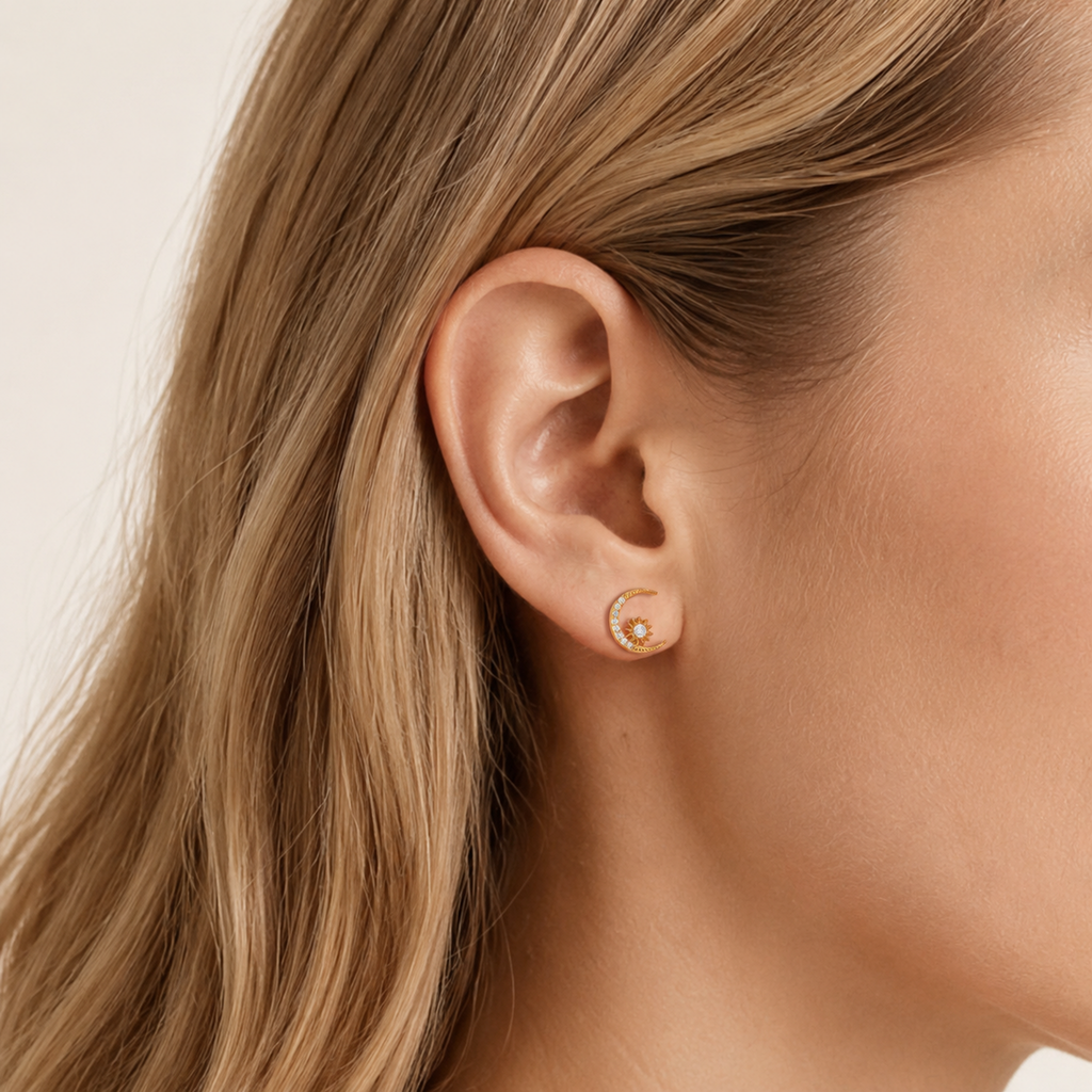 Sterling Silver Zirconia Star and Moon Stud Earrings worn on the ear