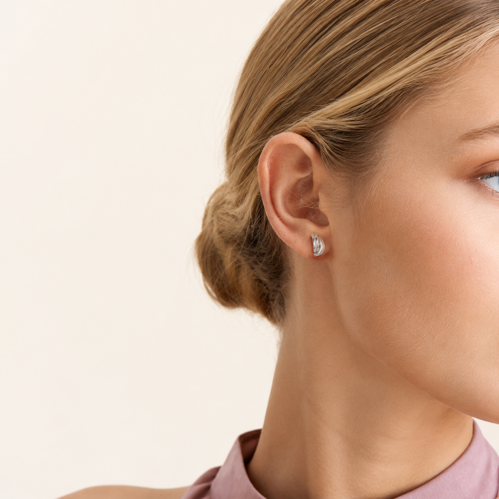 Sterling Silver Minimalist Oval Stud Earrings worn on the ear