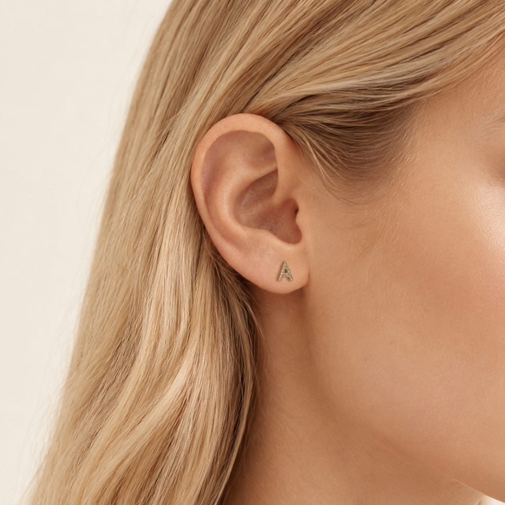 Sterling Silver Pave Initial Letter Stud Earrings worn on the ear