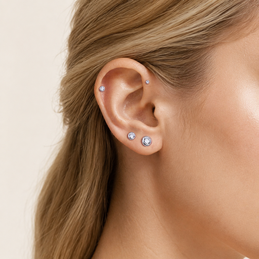 Sterling Silver Bezel-Set Zirconia Flat Back Earrings worn on the ear