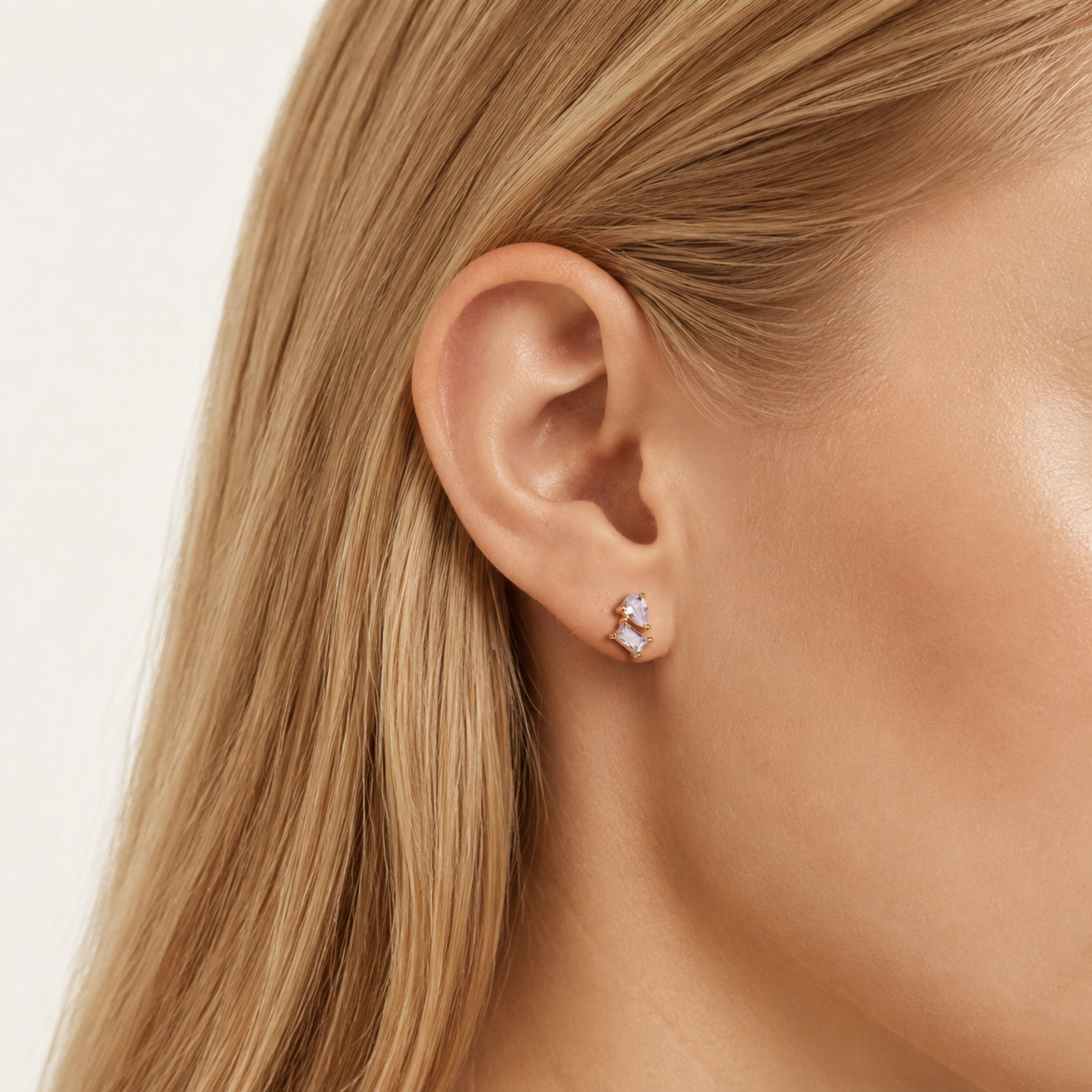 Sterling Silver Mixed-Cut Zirconia Stud Earrings worn on the ear