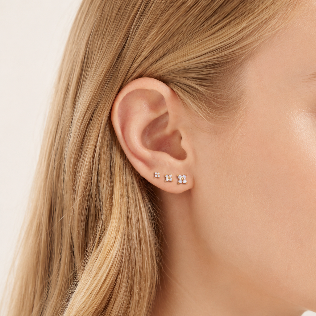 Sterling Silver Four-Leaf Clover Zirconia Flat Back Earrings worn on the ear