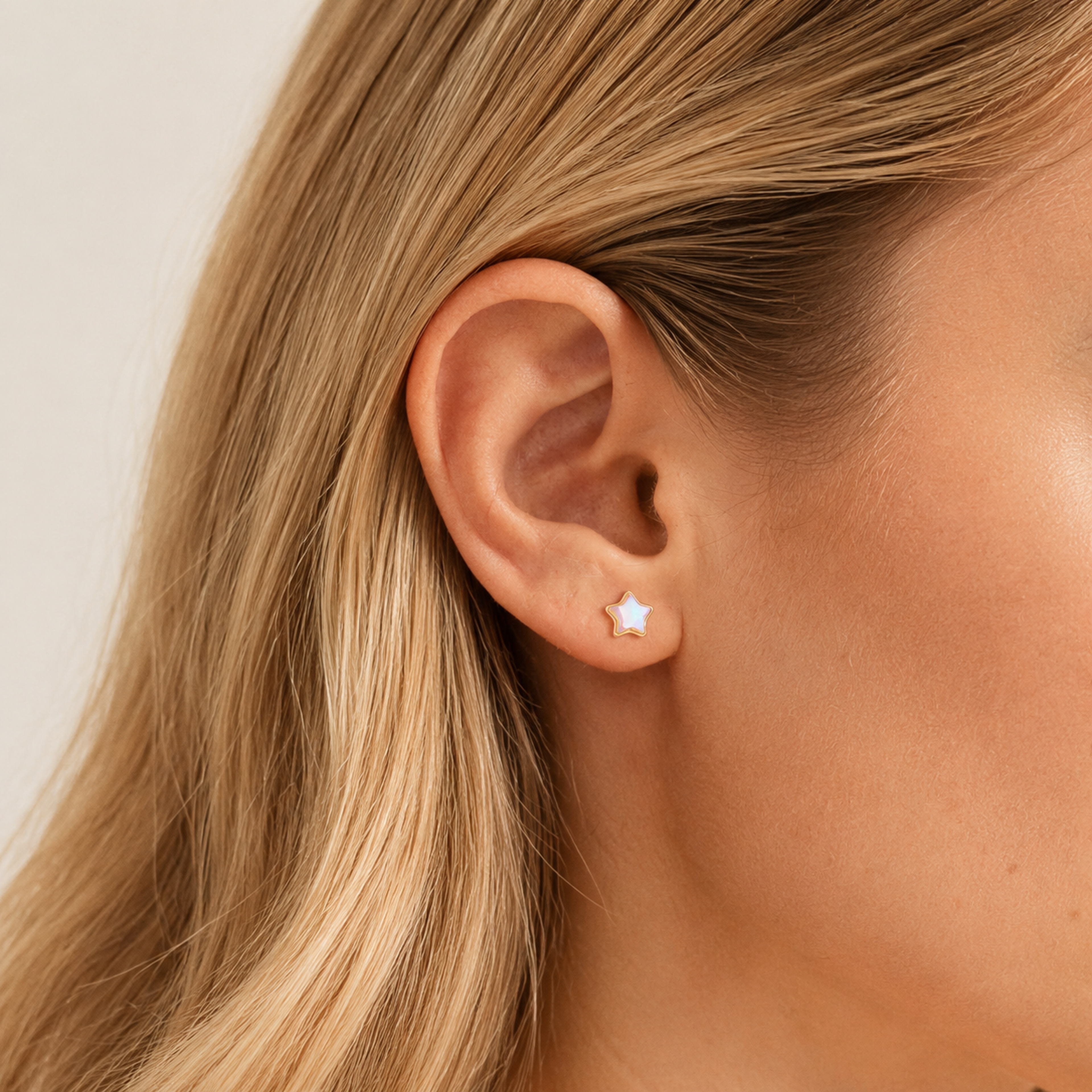 Sterling Silver Moonstone Star Stud Earrings worn on the ear