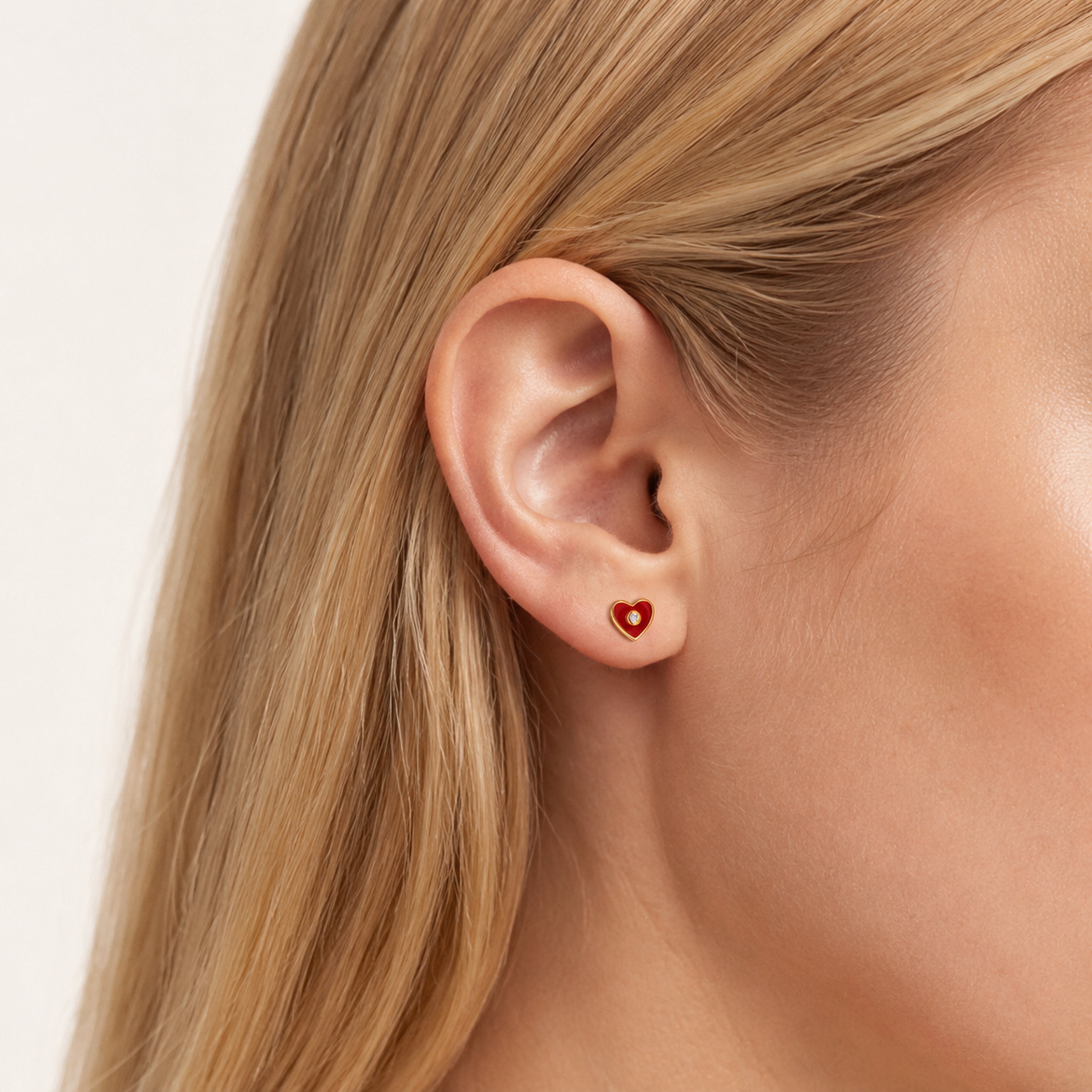 Sterling Silver Sparkling Heart Zirconia Stud Earrings worn on the ear