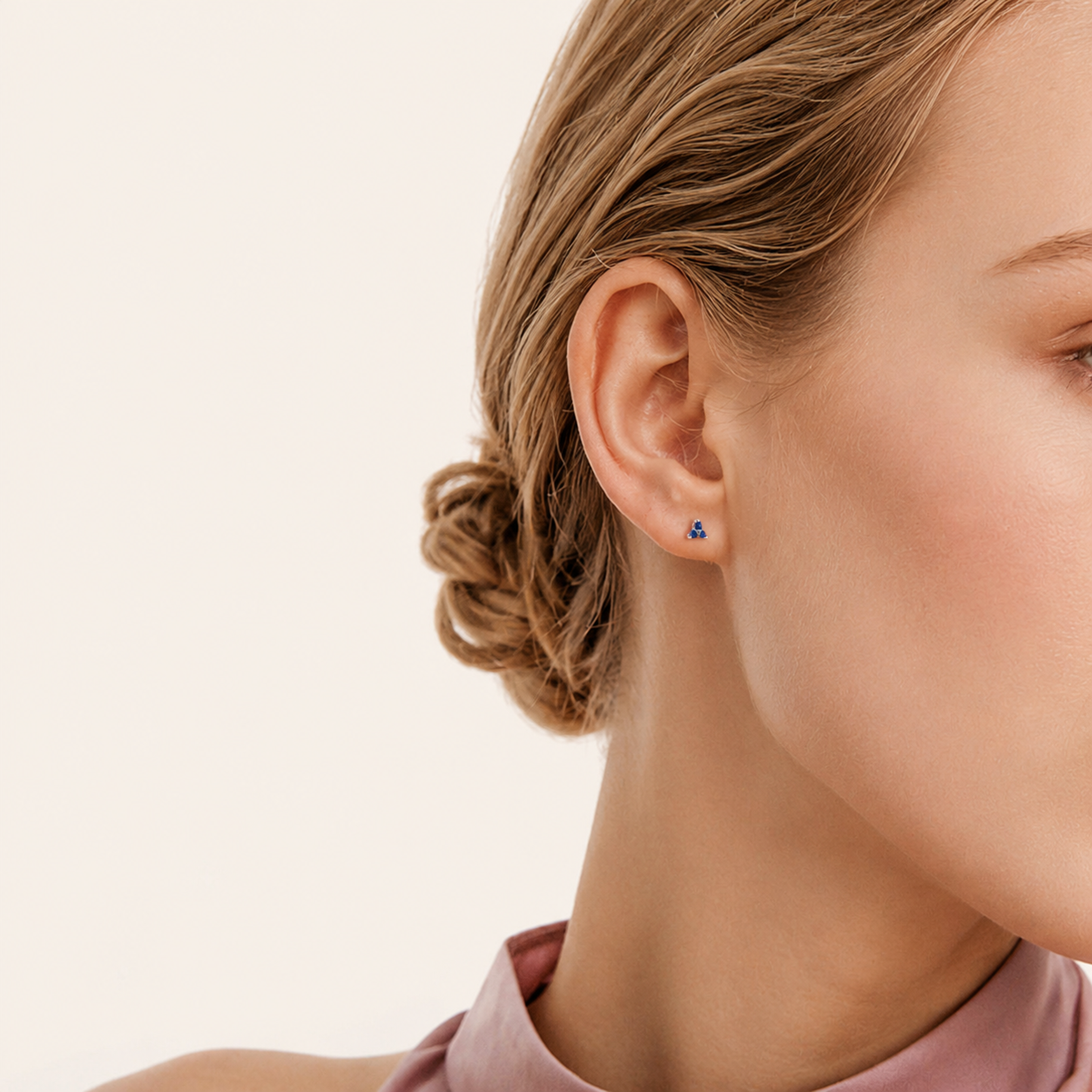 Sterling Silver Triangle Zirconia Stud Earrings worn on the ear