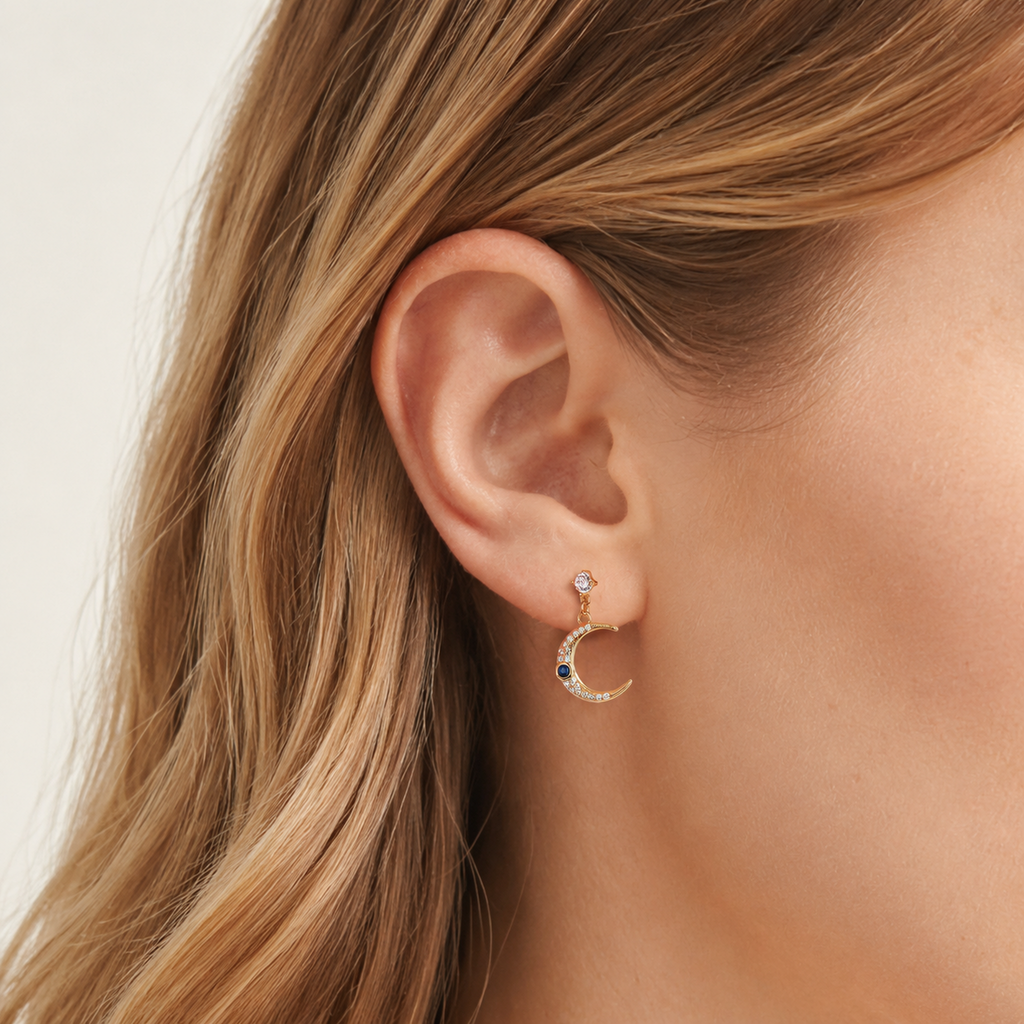 Sterling Silver Star and Moon Chain Drop Stud Earrings worn on the ear