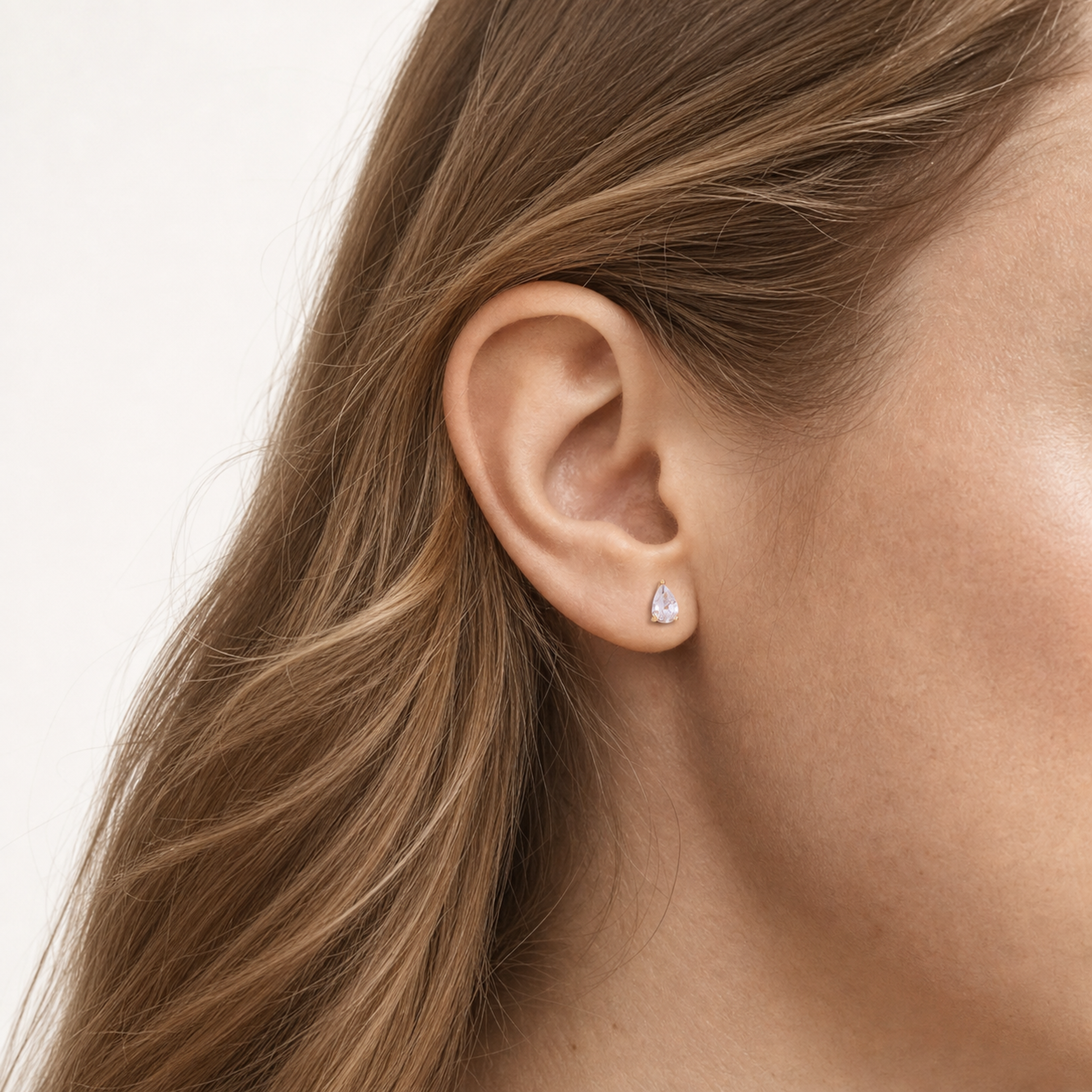Sterling Silver Teardrop Zirconia Stud Earrings worn on the ear
