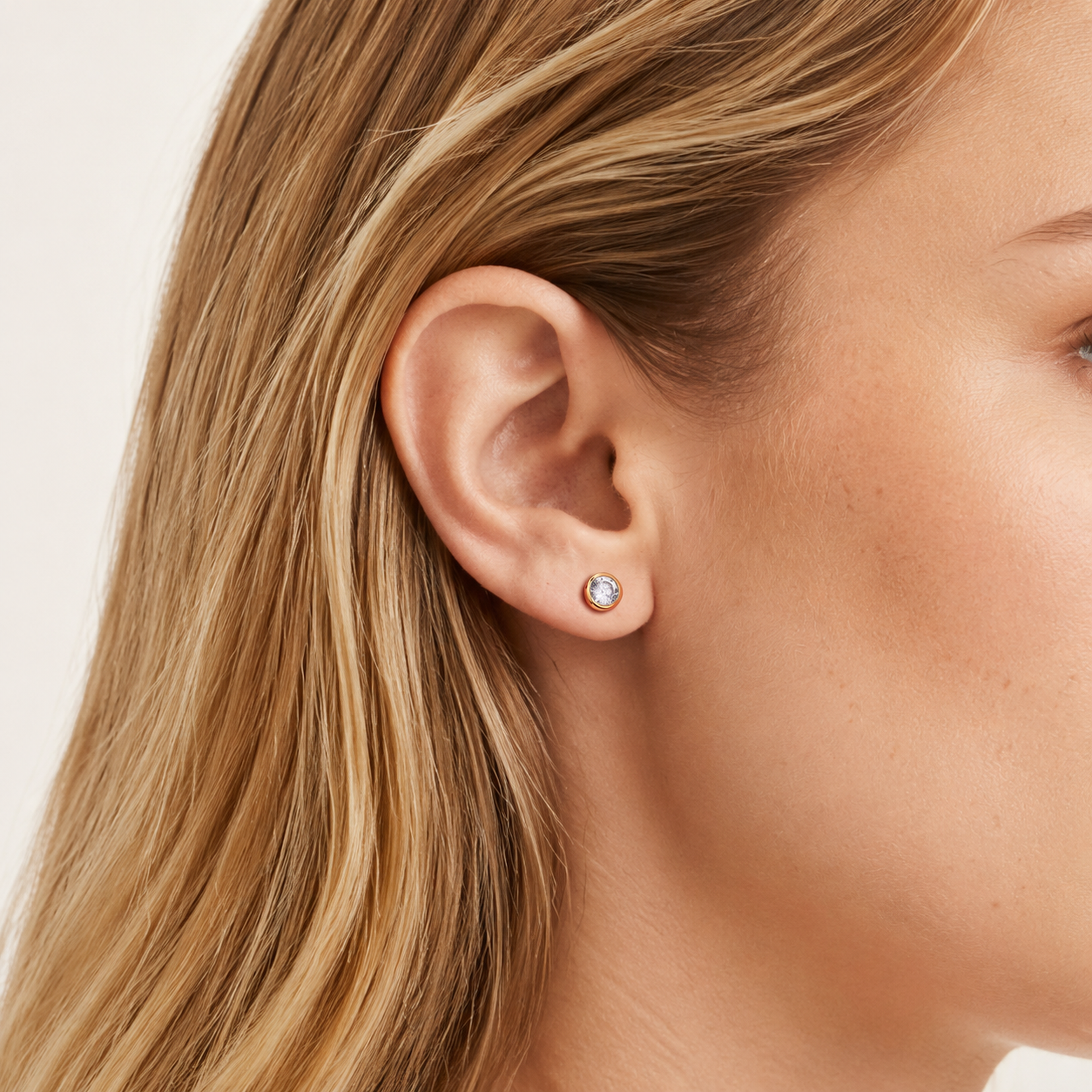 Sterling Silver Round Zirconia Stud Earrings worn on the ear