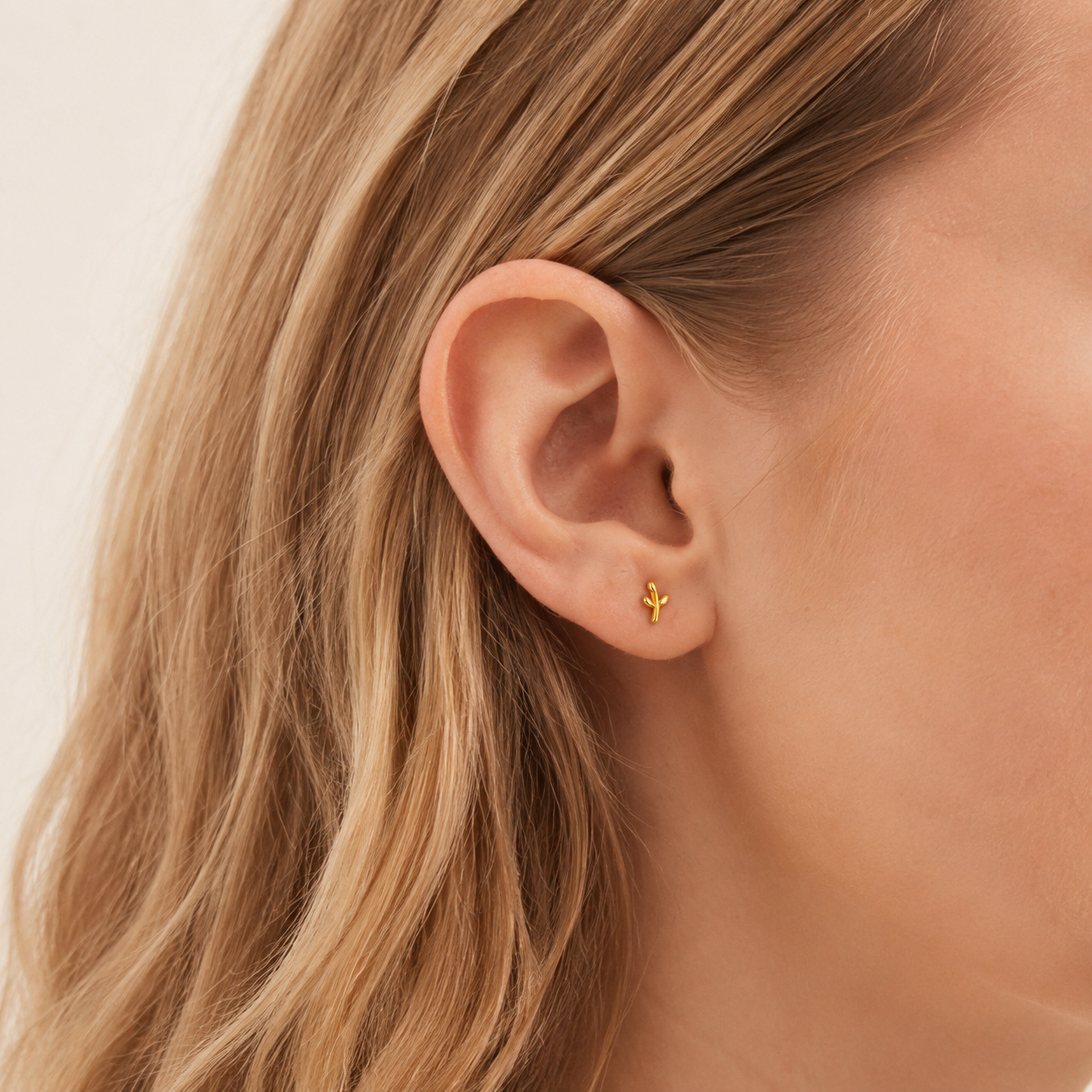 Sterling Silver Leaf Stud Earrings worn on the ear