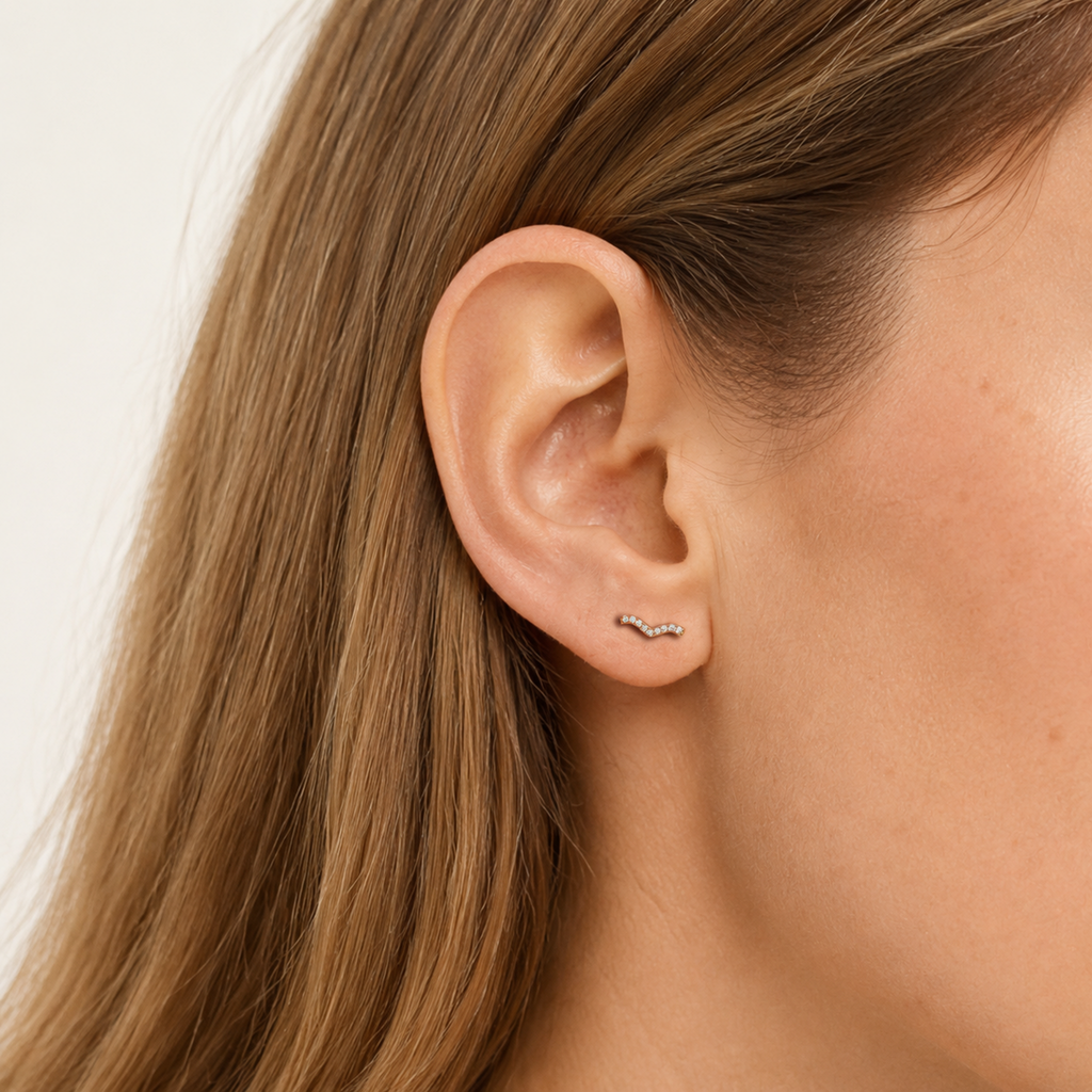 Sterling Silver Spiral Zirconia Cartilage Flat Back Earrings worn on the ear