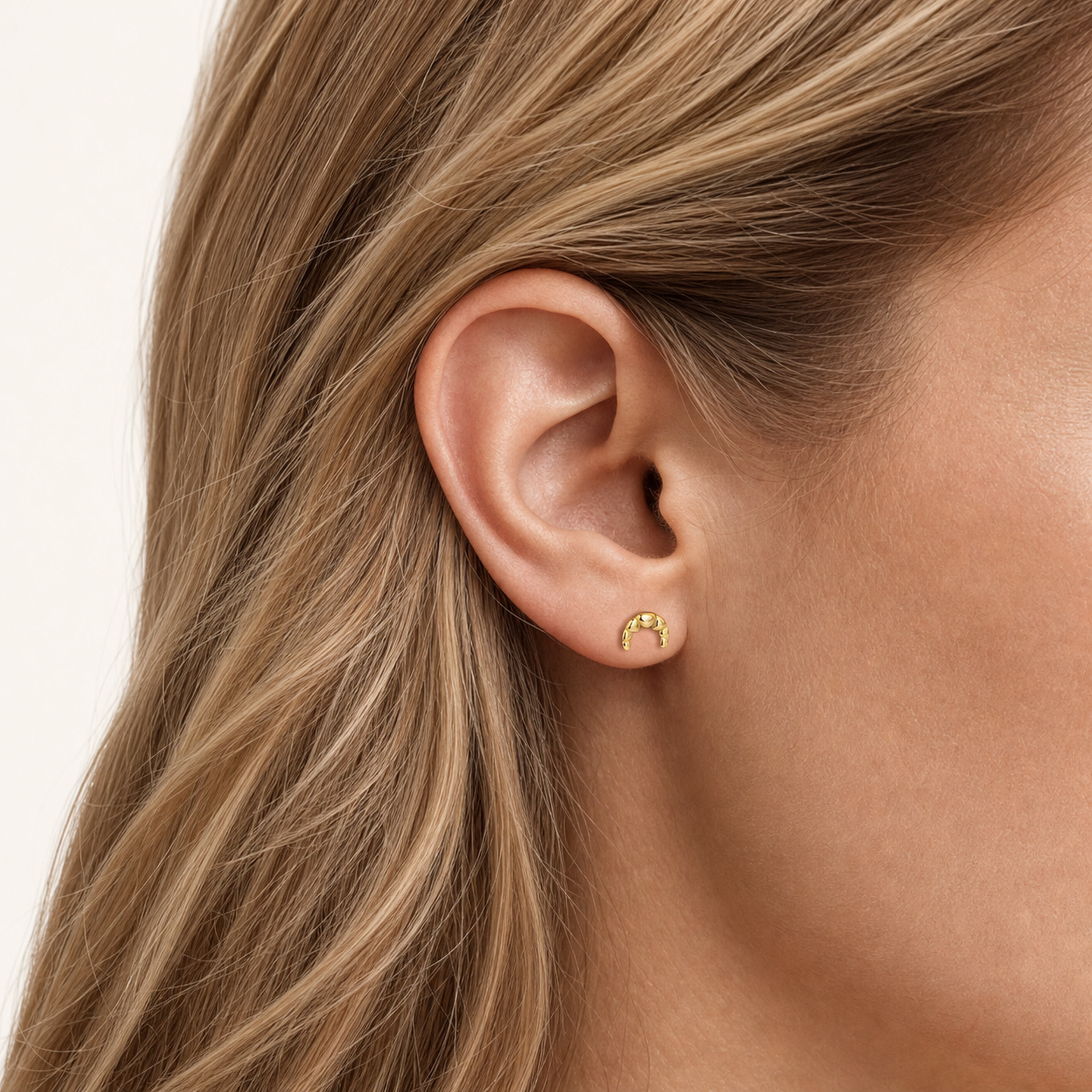 Sterling Silver Croissant Twist Flat Back Earrings worn on the ear