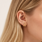 Sterling Silver Polished C-Shape Stud Earrings worn on the ear