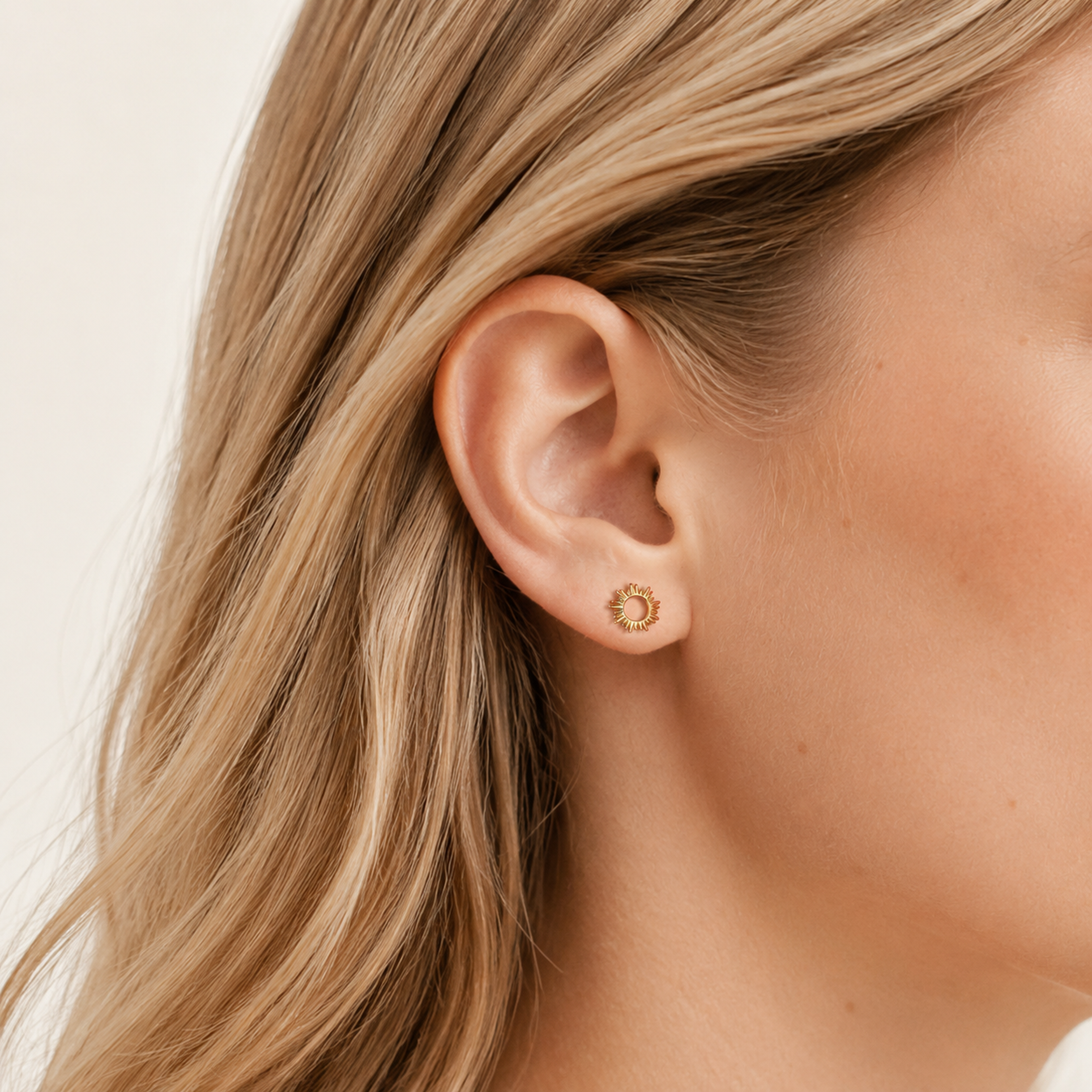 Sterling Silver Little Sun Stud Earrings worn on the ear