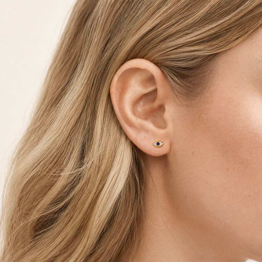 Sterling Silver Evil Eye Zirconia Stud Earrings worn on the ear