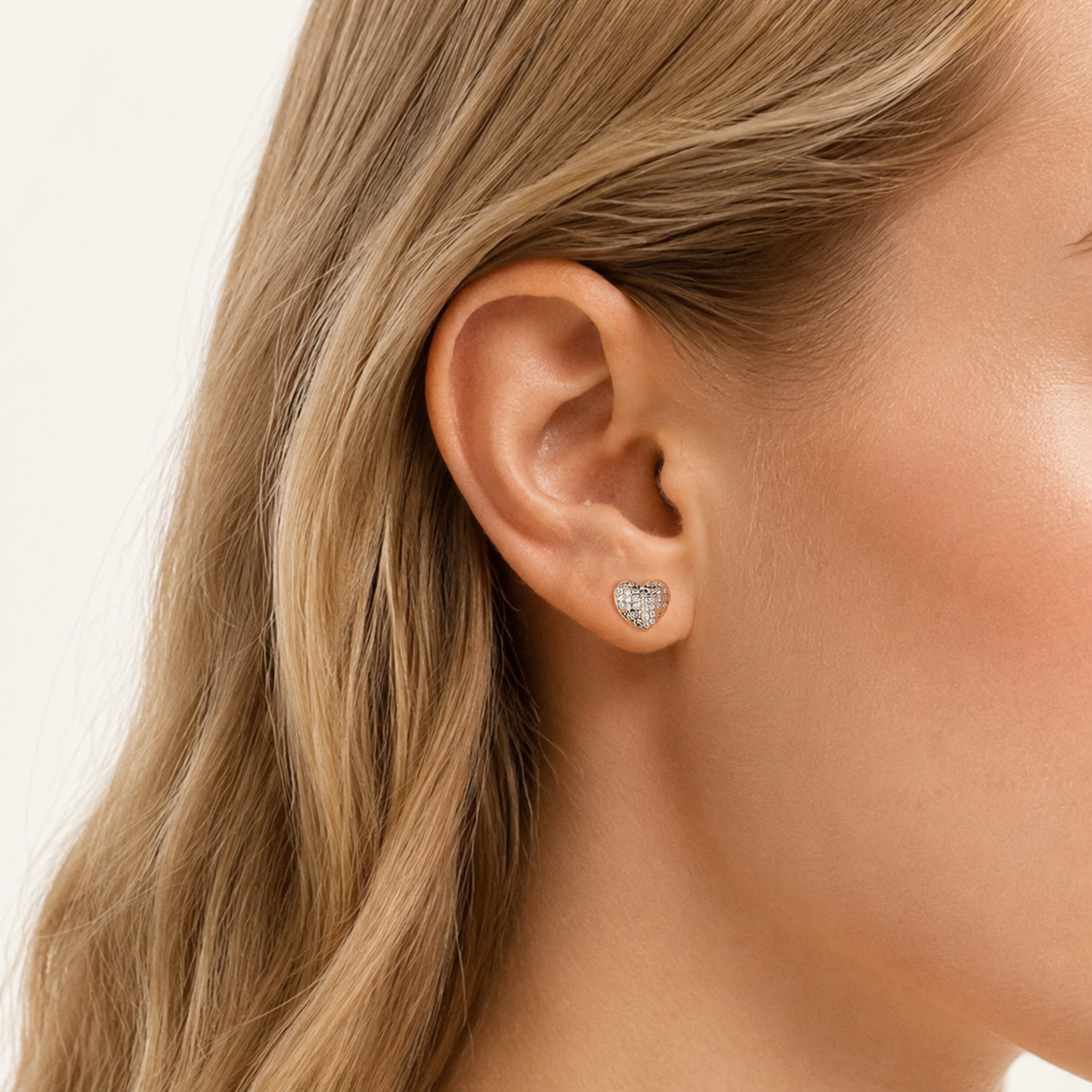 Sterling Silver Pave Heart Zirconia Stud Earrings worn on the ear
