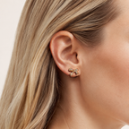 Sterling Silver Pavé Bow Stud Earrings worn on the ear