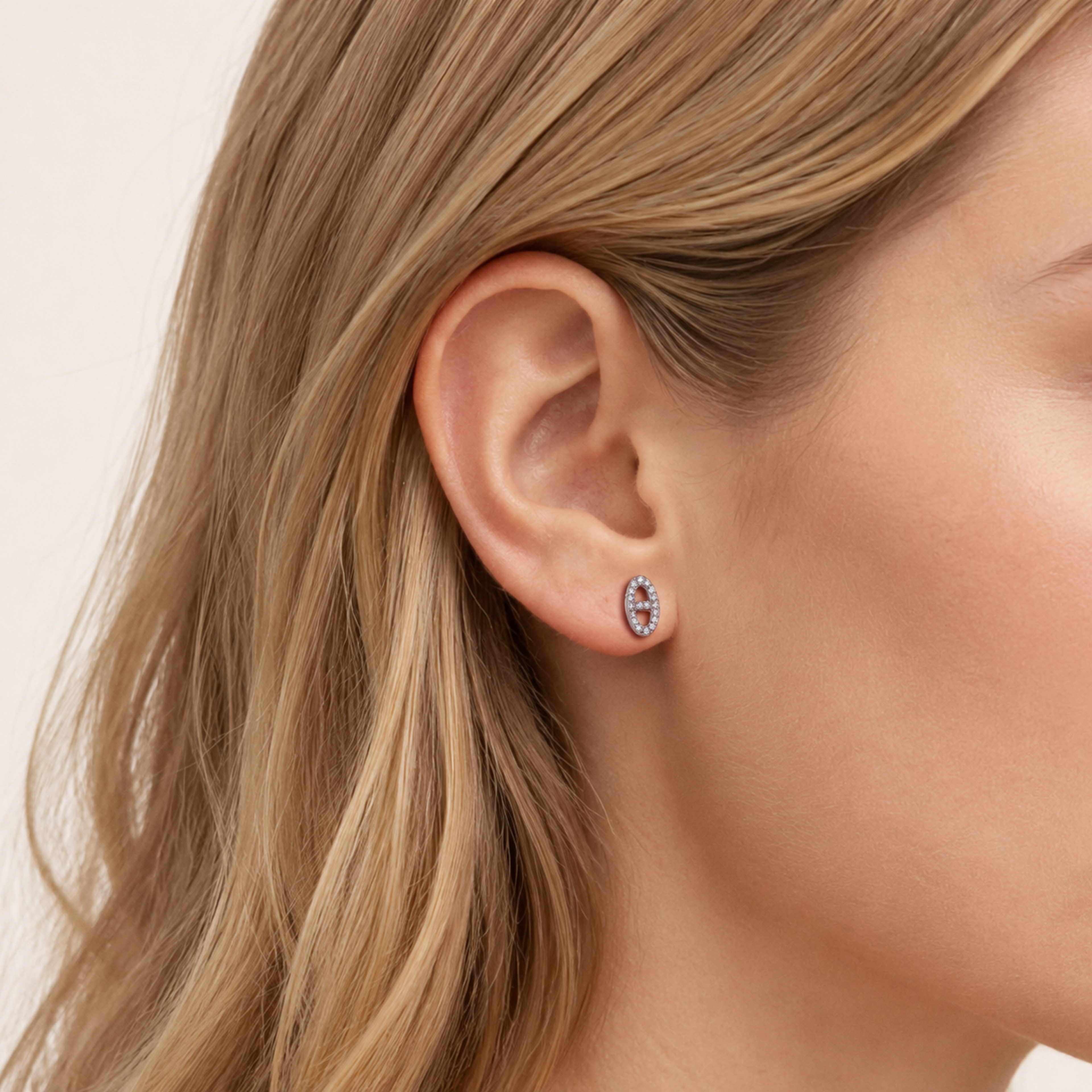 Sterling Silver Pave Initial H Stud Earrings worn on the ear