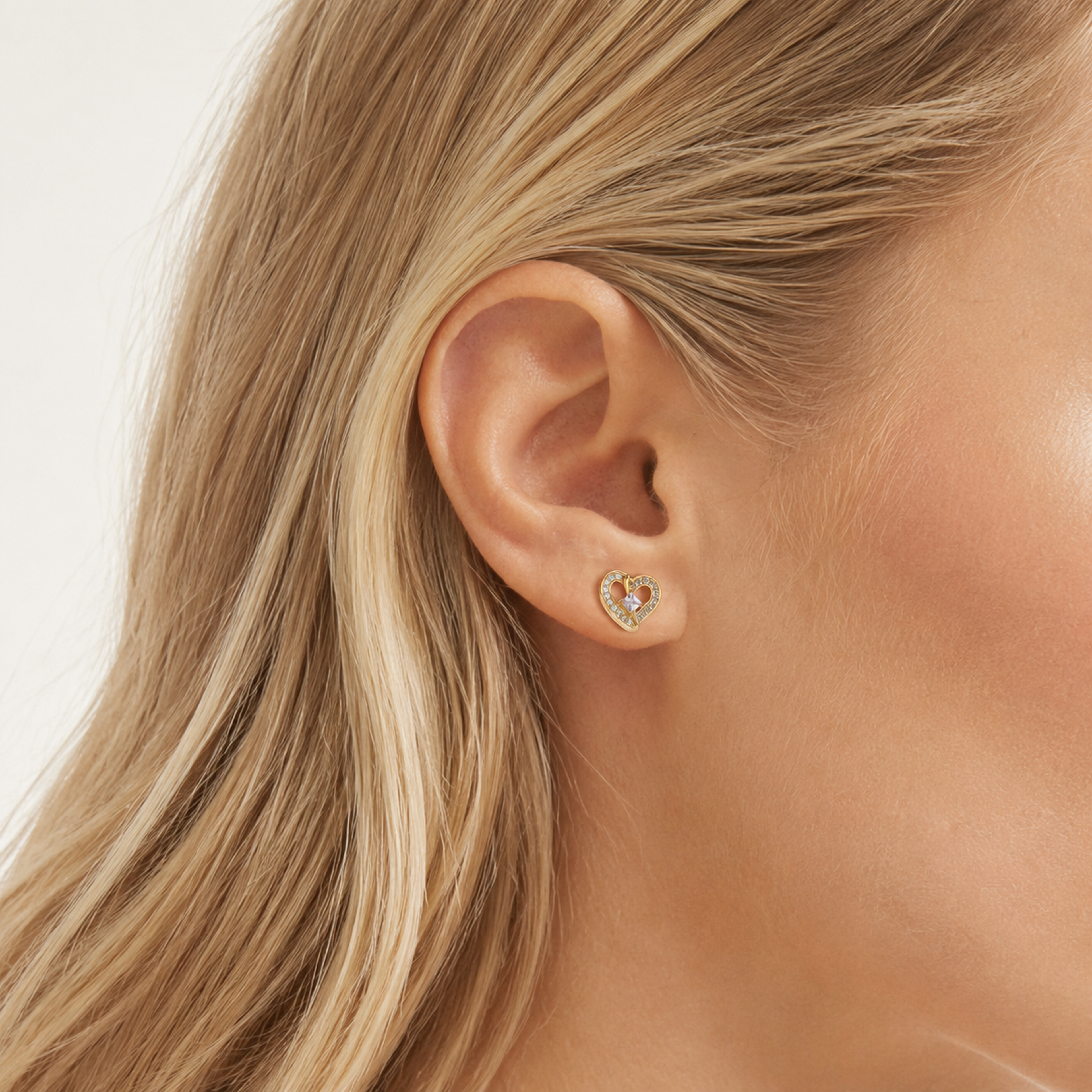 Sterling Silver Zirconia Heart Stud Earrings worn on the ear