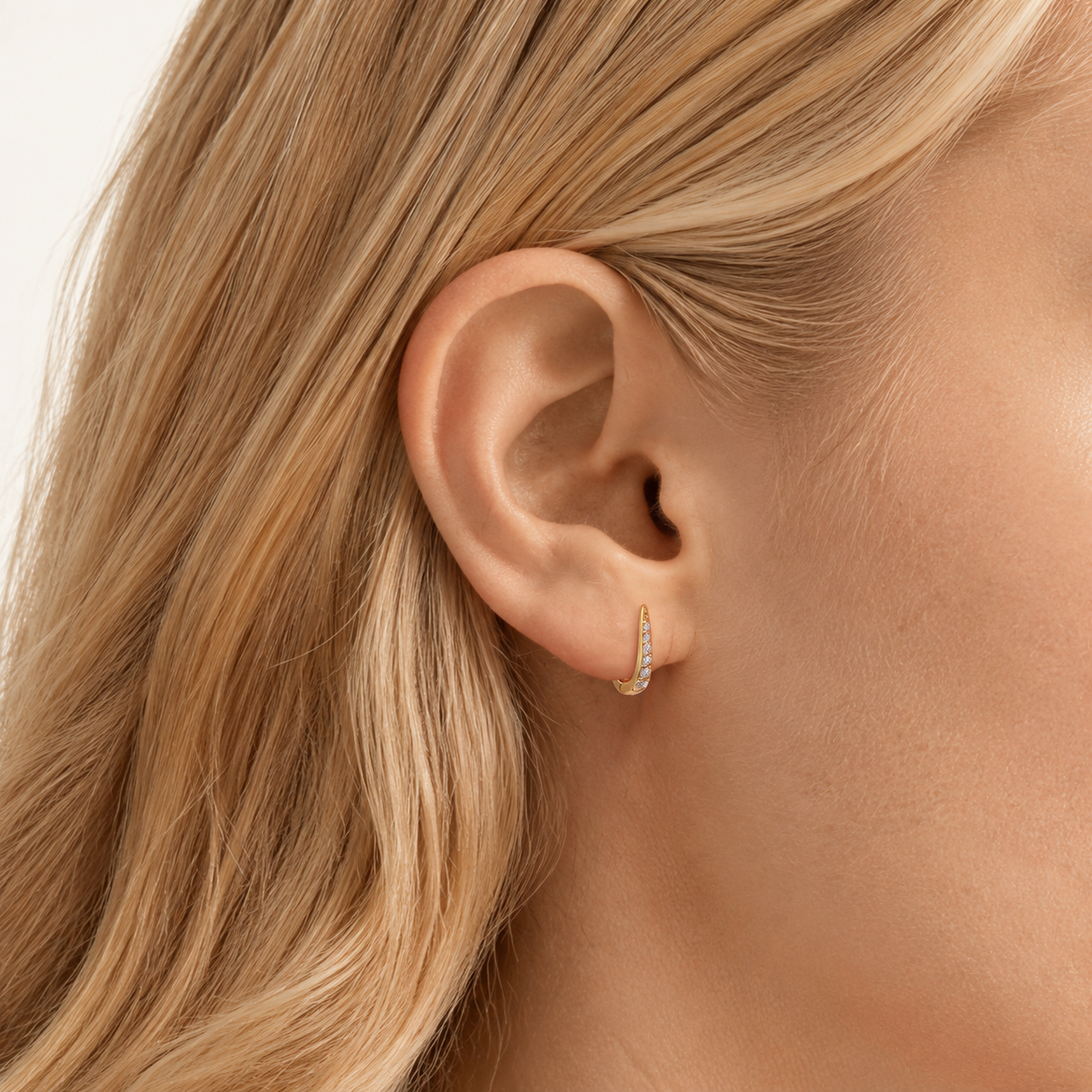 Sterling Silver Single-Row Zirconia Hoop Earrings worn on the ear