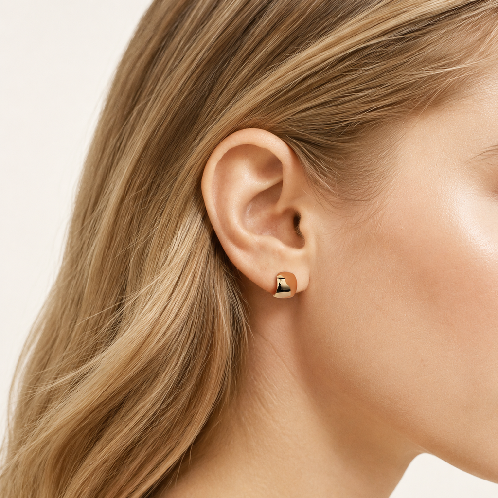 Sterling Silver Polished Arch Stud Earrings worn on the ear