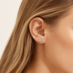 Sterling Silver Snowflake Zirconia Stud Earrings worn on the ear