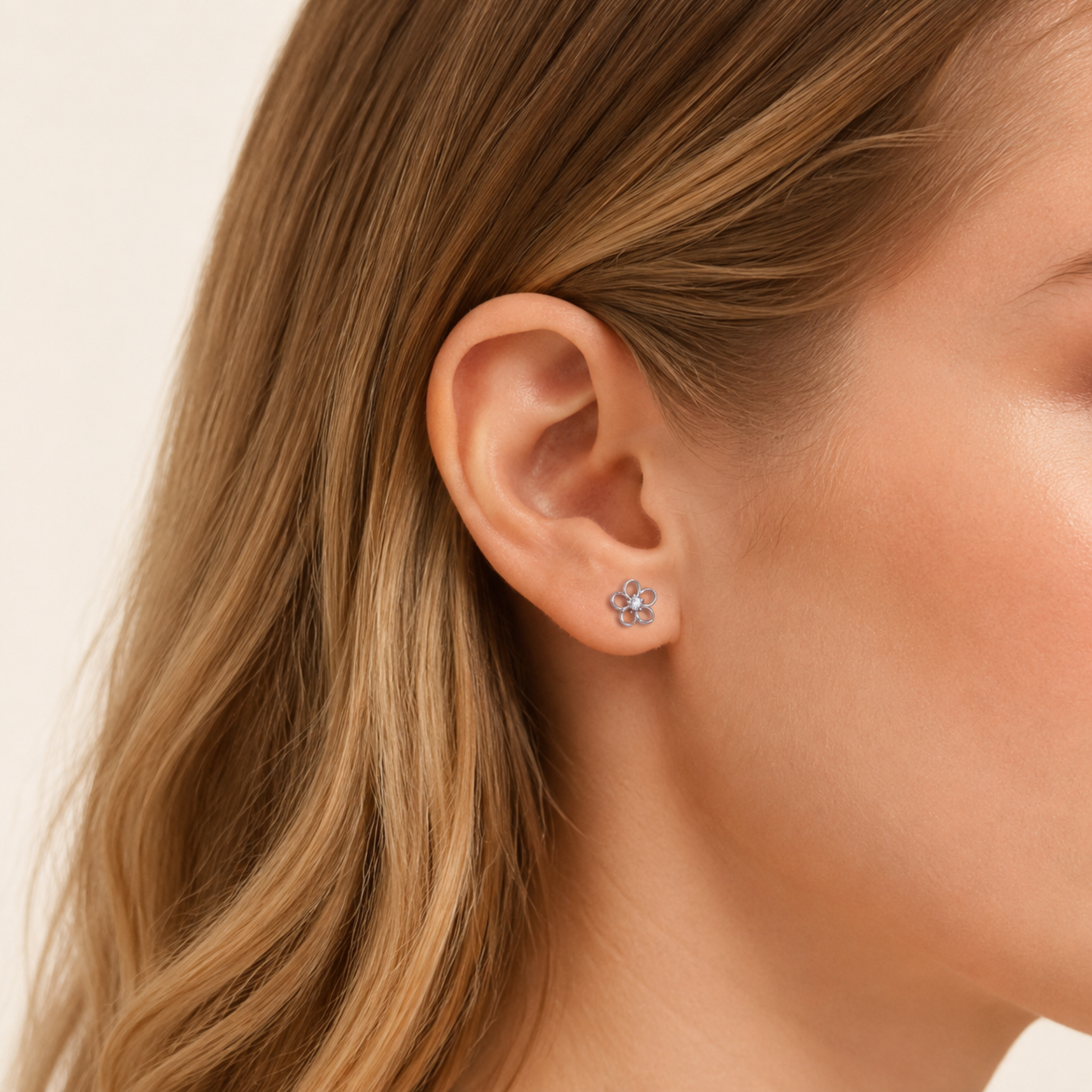 Sterling Silver Openwork Flower Flat Back Earrings worn on the ear