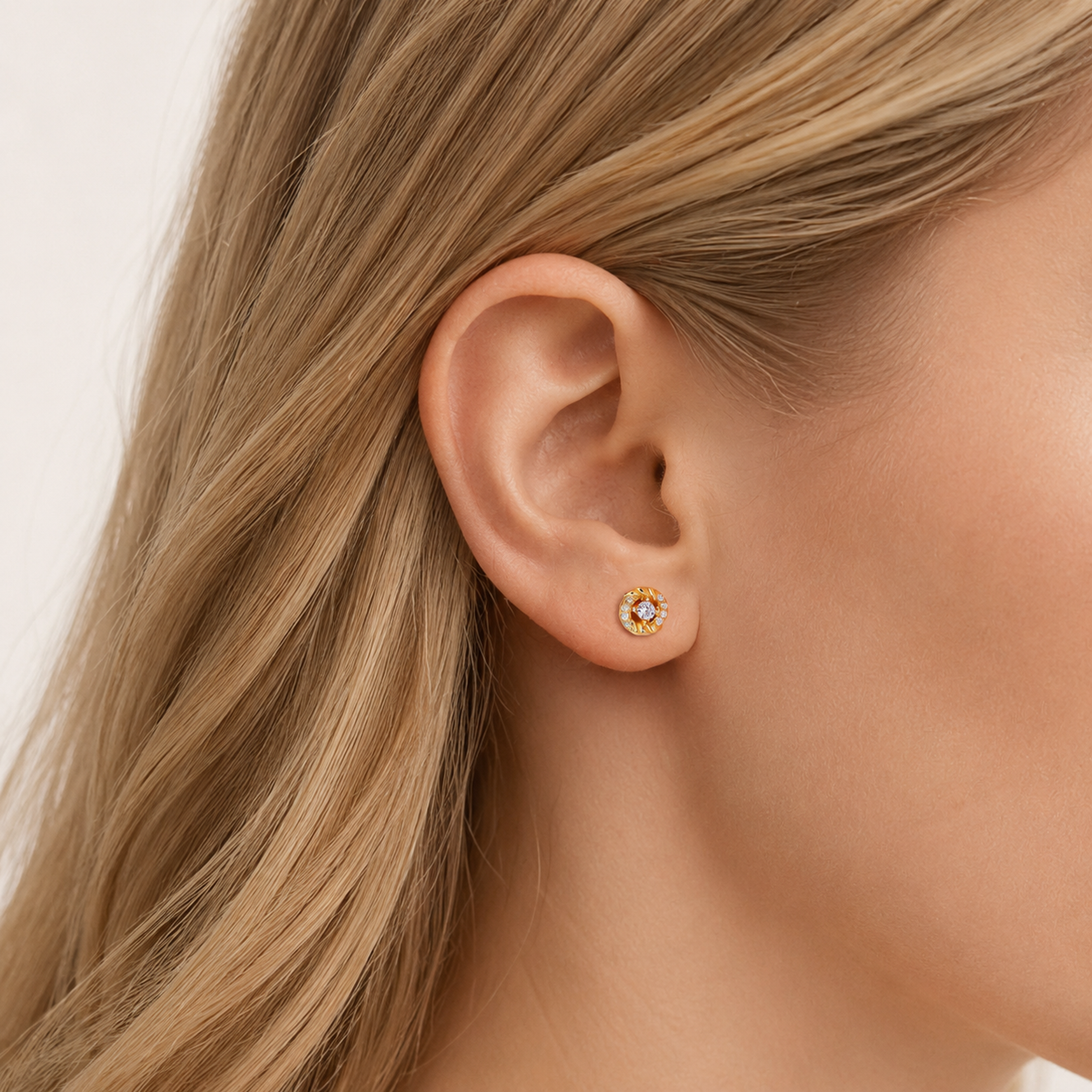 Sterling Silver Zirconia Twist Stud Earrings worn on the ear