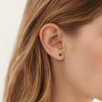 Sterling Silver Vintage Emerald-Green Zirconia Stud Earrings worn on the ear