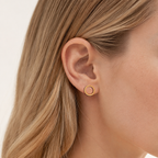 Sterling Silver Polished Twist Stud Earrings worn on the ear