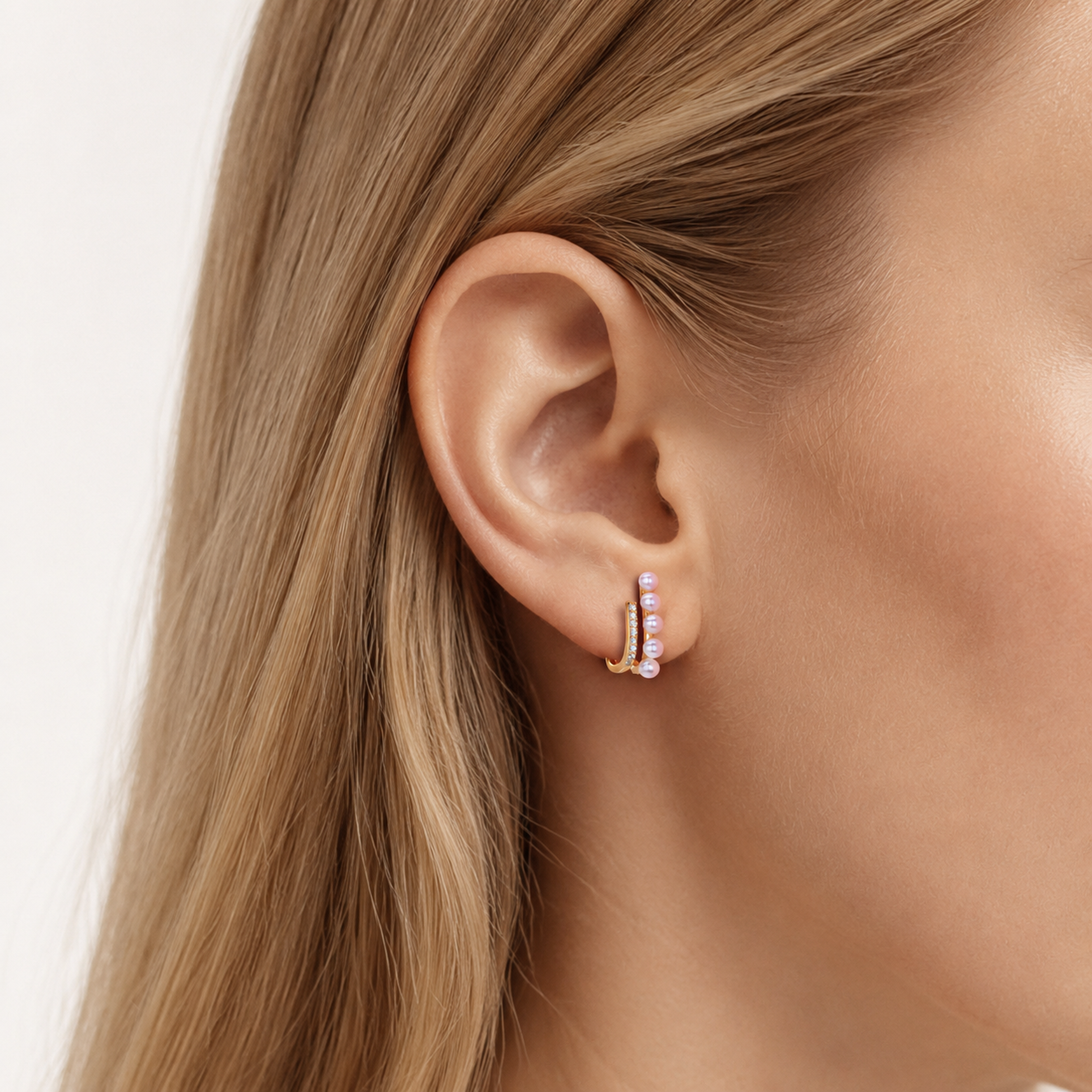 Sterling Silver Pearl & Zirconia Stud Earrings worn on the ear