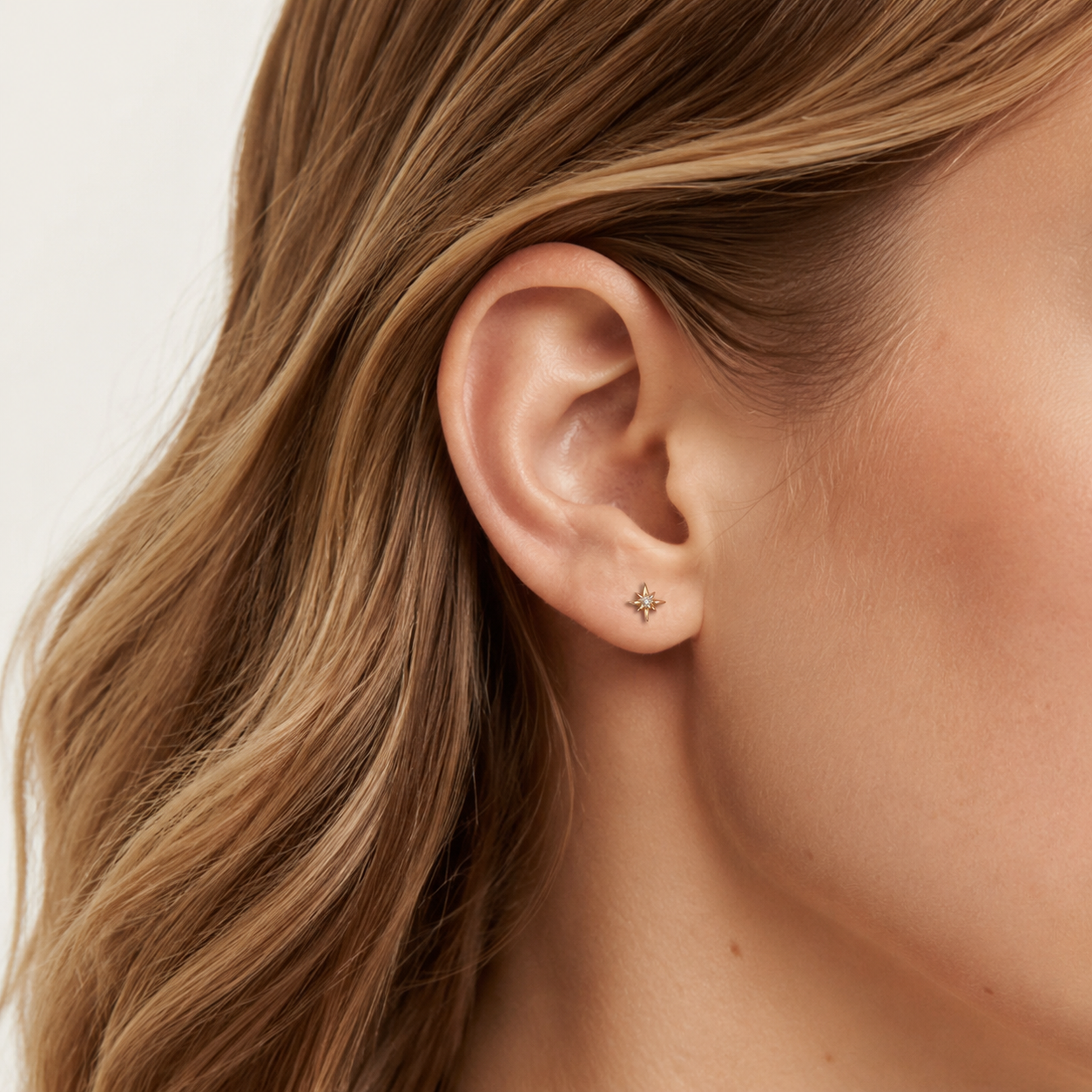 Sterling Silver Eight-Point Star Zirconia Flat Back Earrings worn on the ear