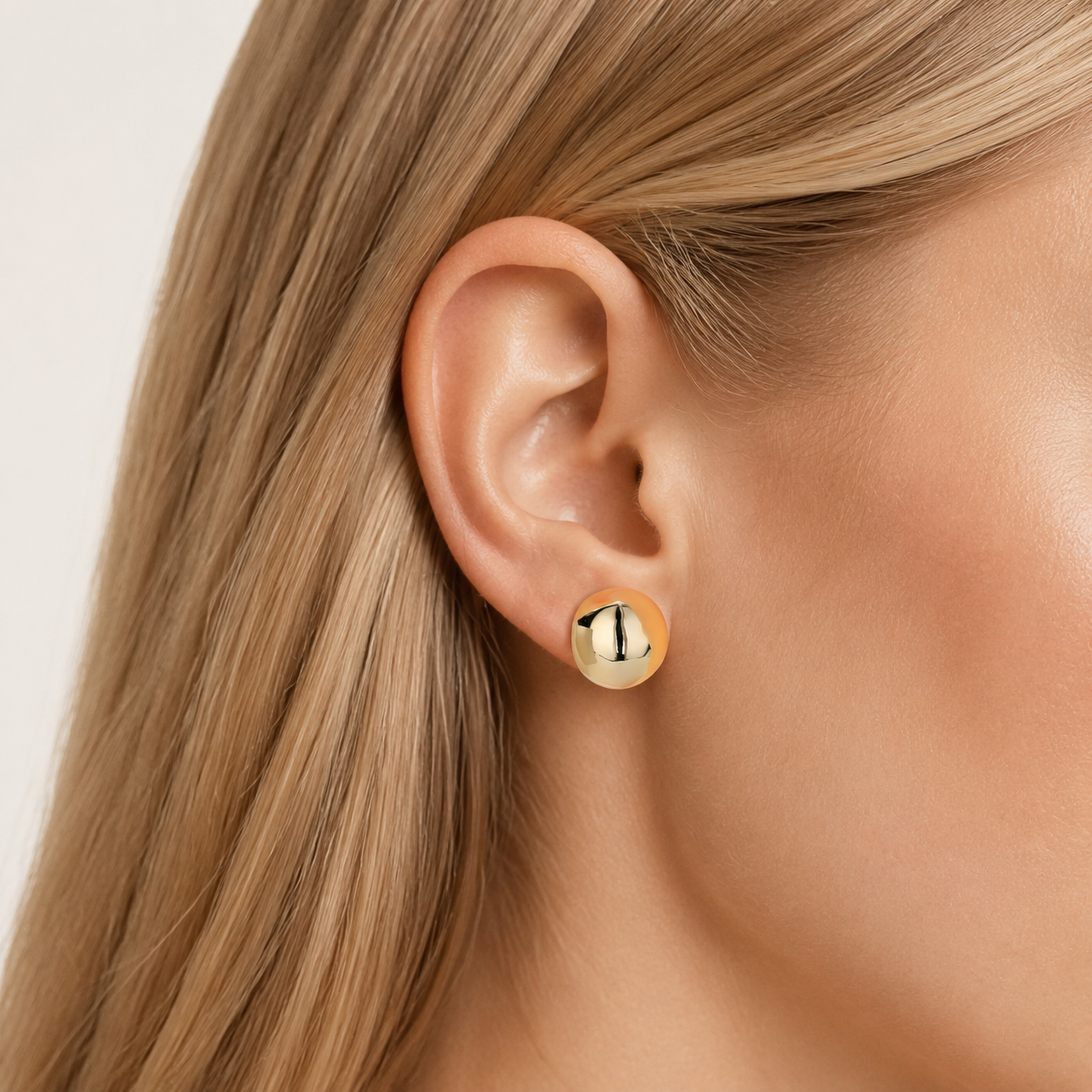 Sterling Silver Polished Half-Circle Stud Earrings worn on the ear